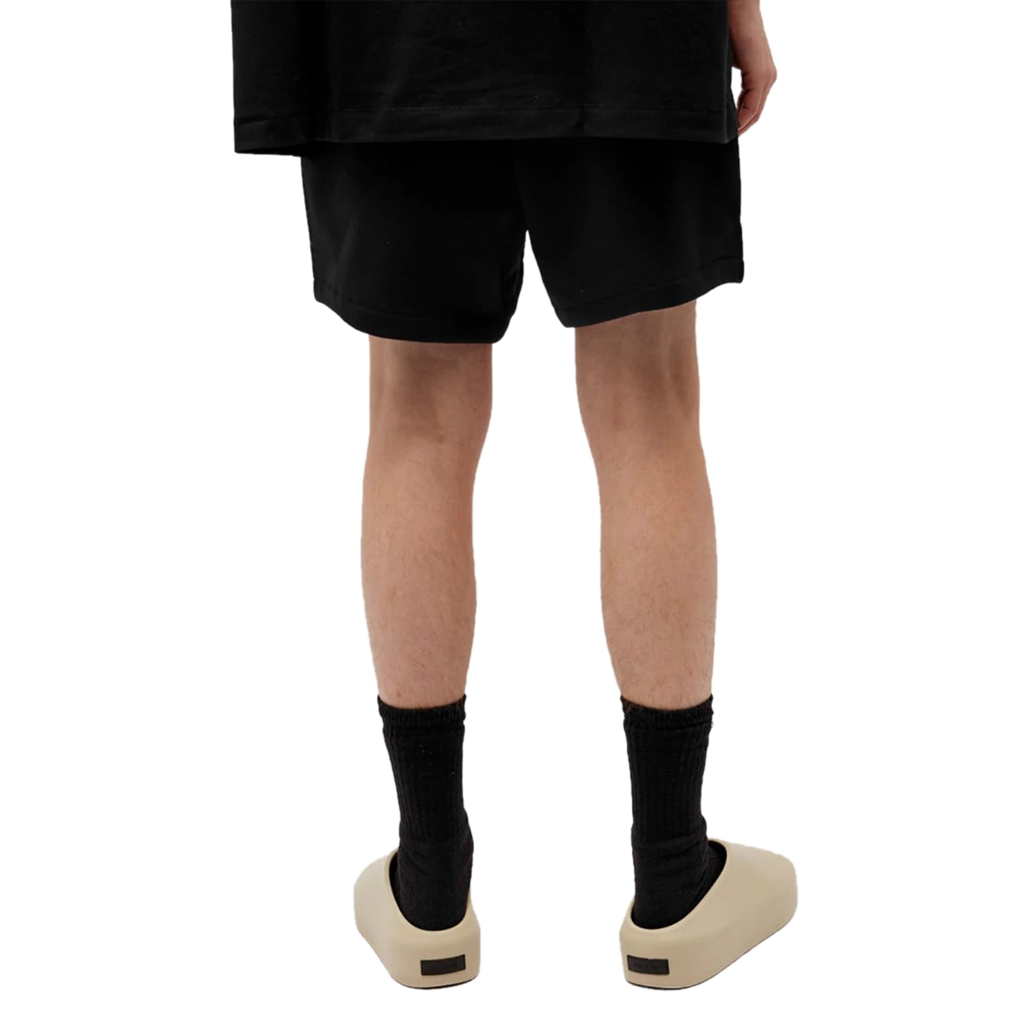Model back view of Fear Of God Essentials Jet Black Shorts (FW23) 160BT232000F