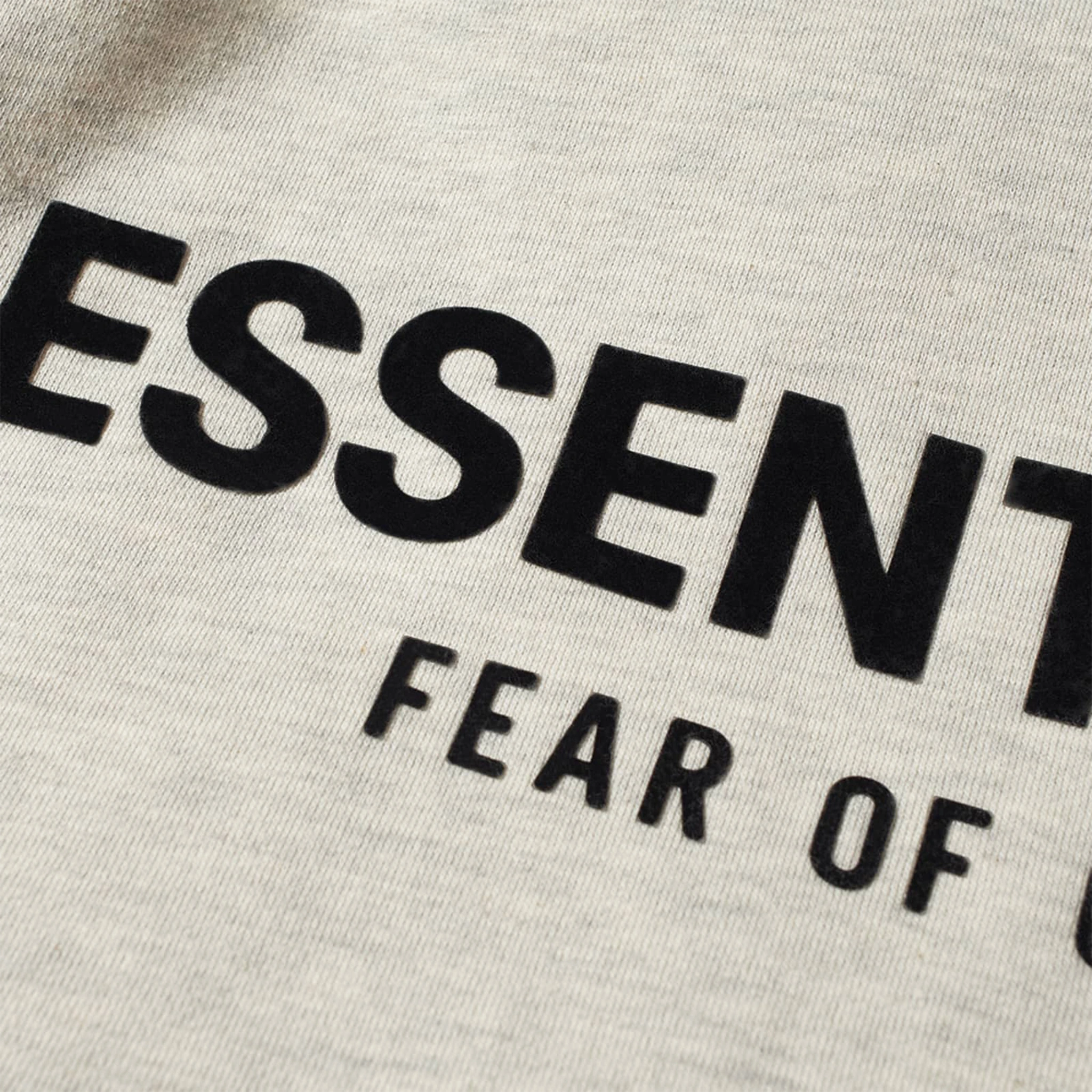 Logo view of Fear Of God Essentials Relaxed Light Oatmeal Hoodie (SS22)