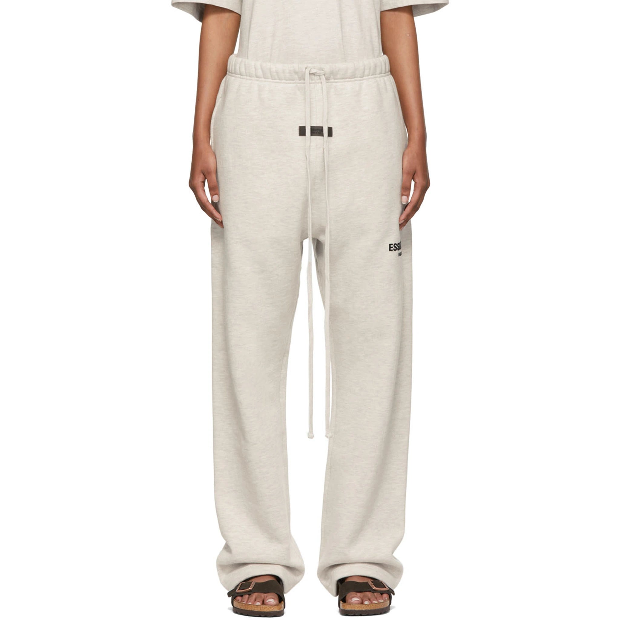 Model front view of Fear Of God Essentials Relaxed Light Oatmeal Sweatpants (SS22)