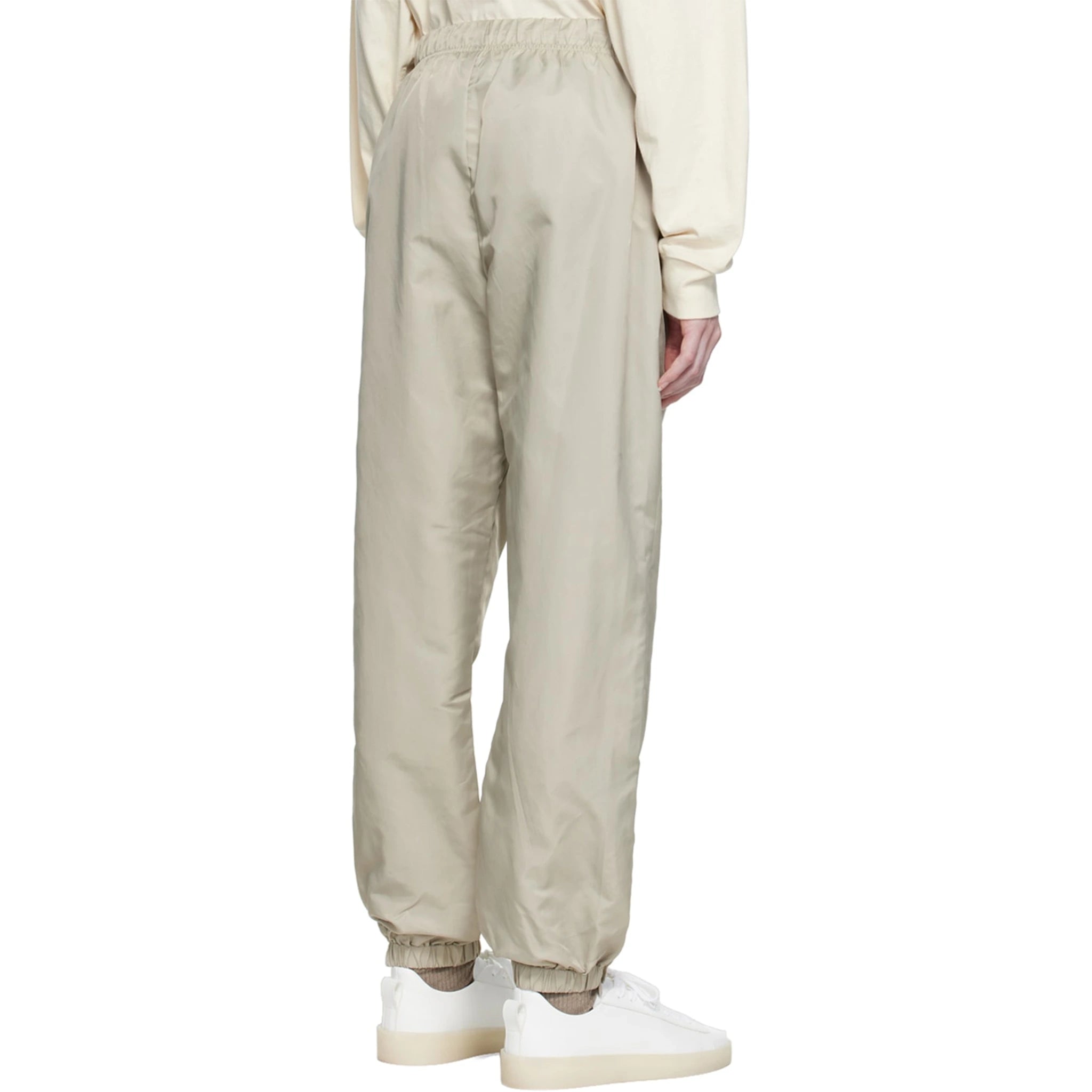 Model back view of Fear Of God Essentials Smoke Track Pants (FW22) 130SU222161F