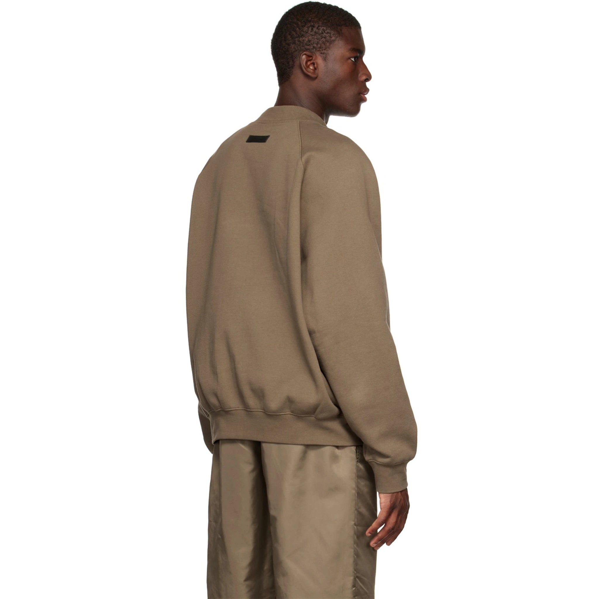 Model back view of Fear Of God Essentials Wood Crewneck (FW22)