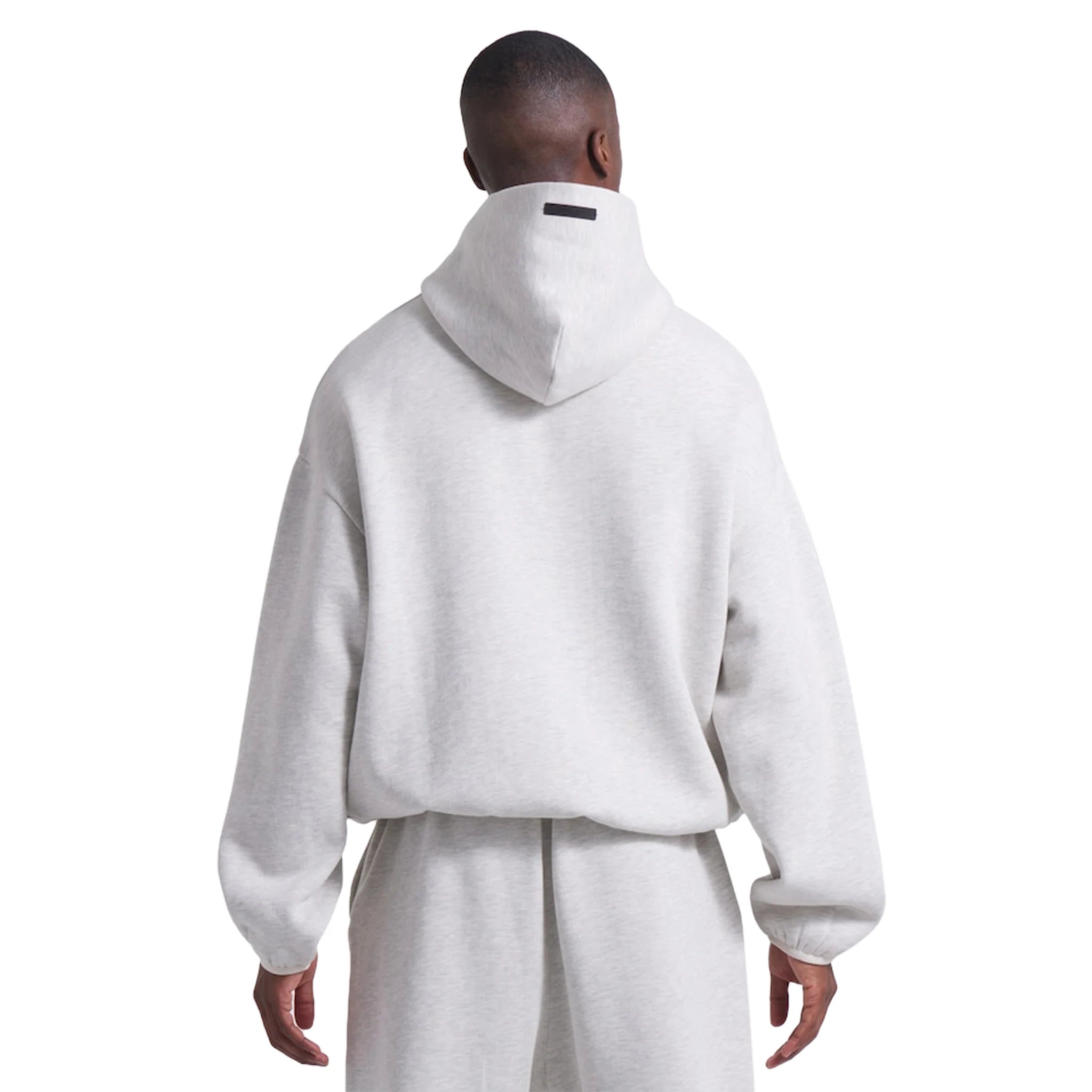 Model back view of Fear Of God Essentials x NBA Light Heather Hoodie 192AL246400F