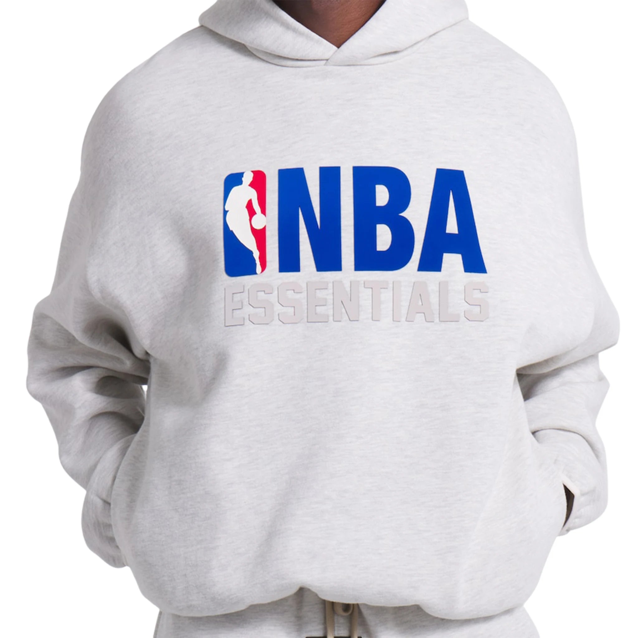 Model front view of Fear Of God Essentials x NBA Light Heather Hoodie 192AL246400F