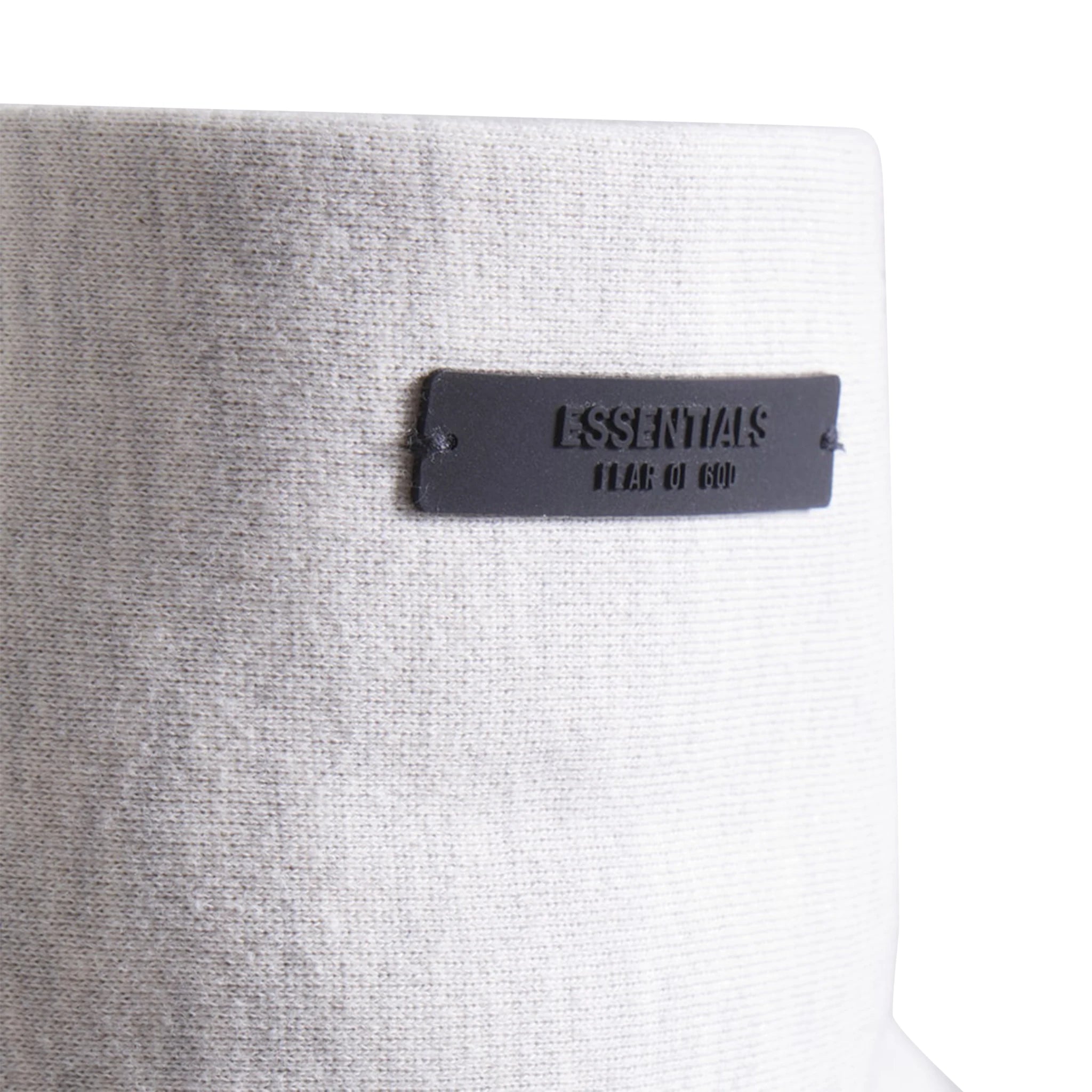 Model hood view of Fear Of God Essentials x NBA Light Heather Hoodie 192AL246400F