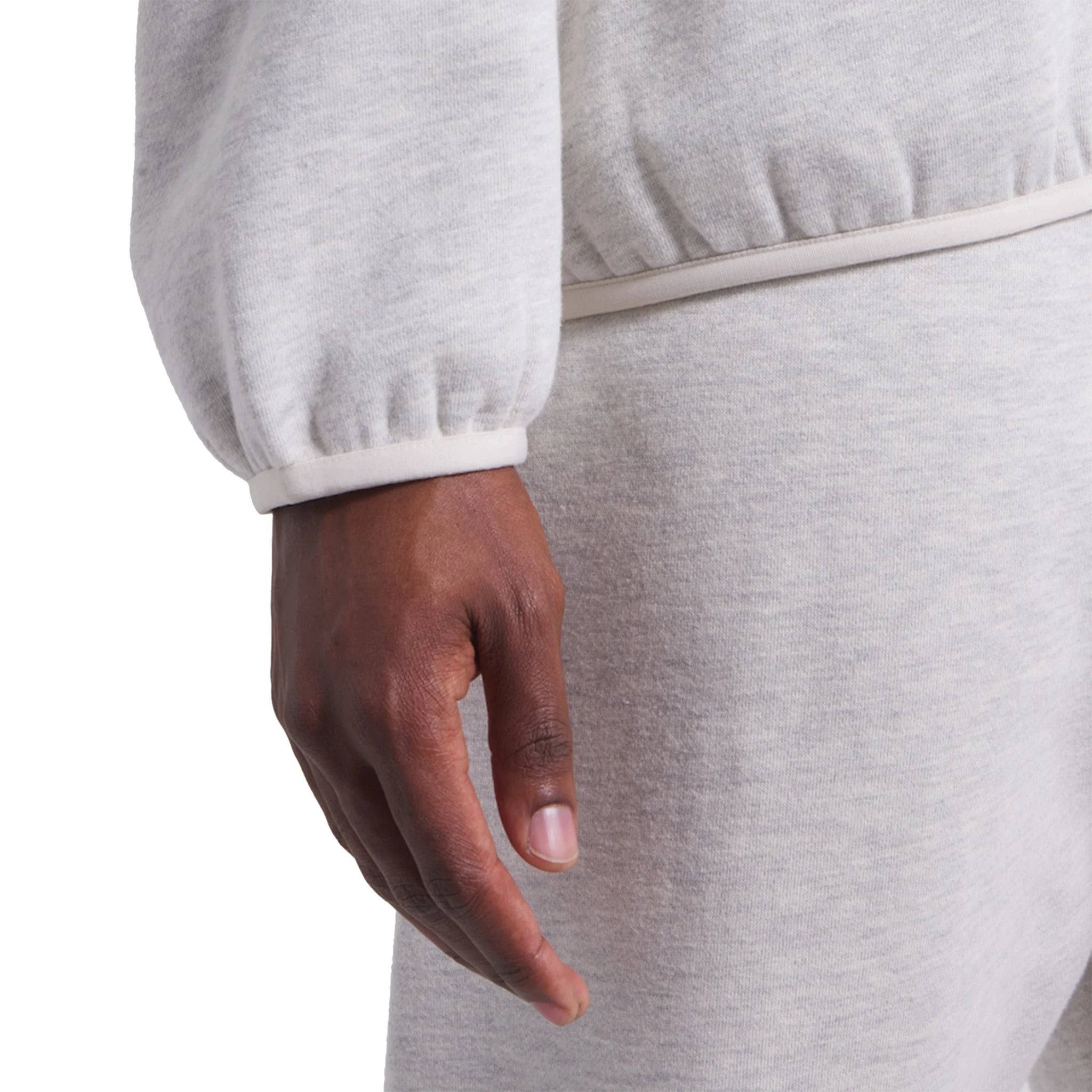 Model sleeve view of Fear Of God Essentials x NBA Light Heather Hoodie 192AL246400F