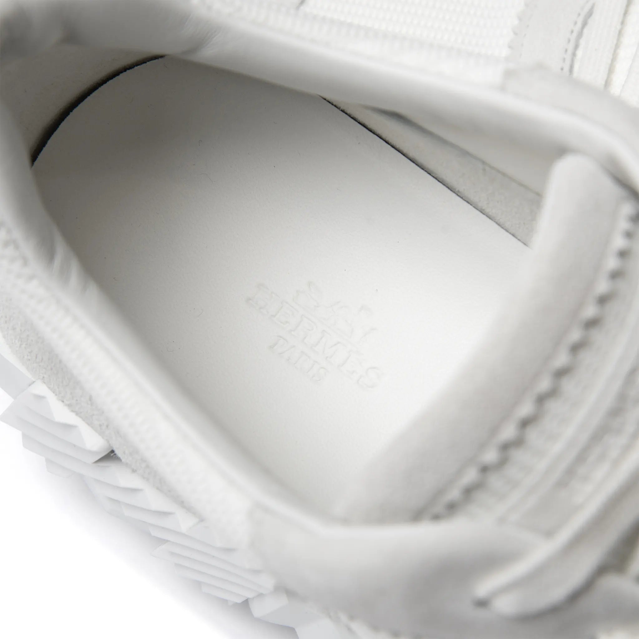 Close up view of Hermès Paris Bouncing Sneaker Triple White