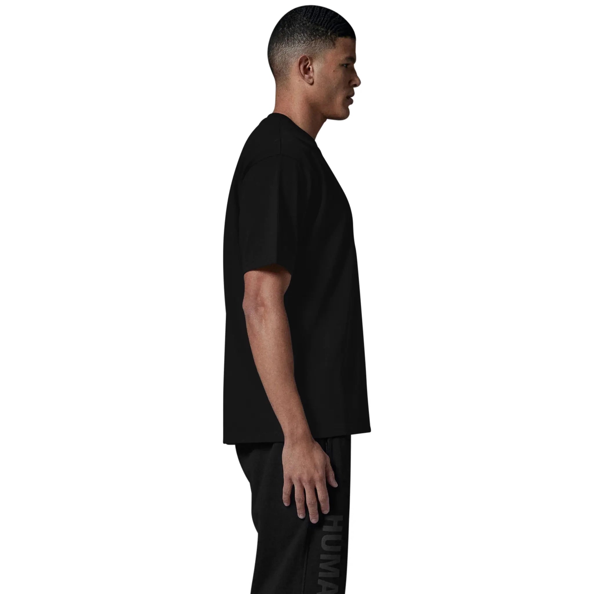 Model side view of Human Race Made Jet Black T Shirt