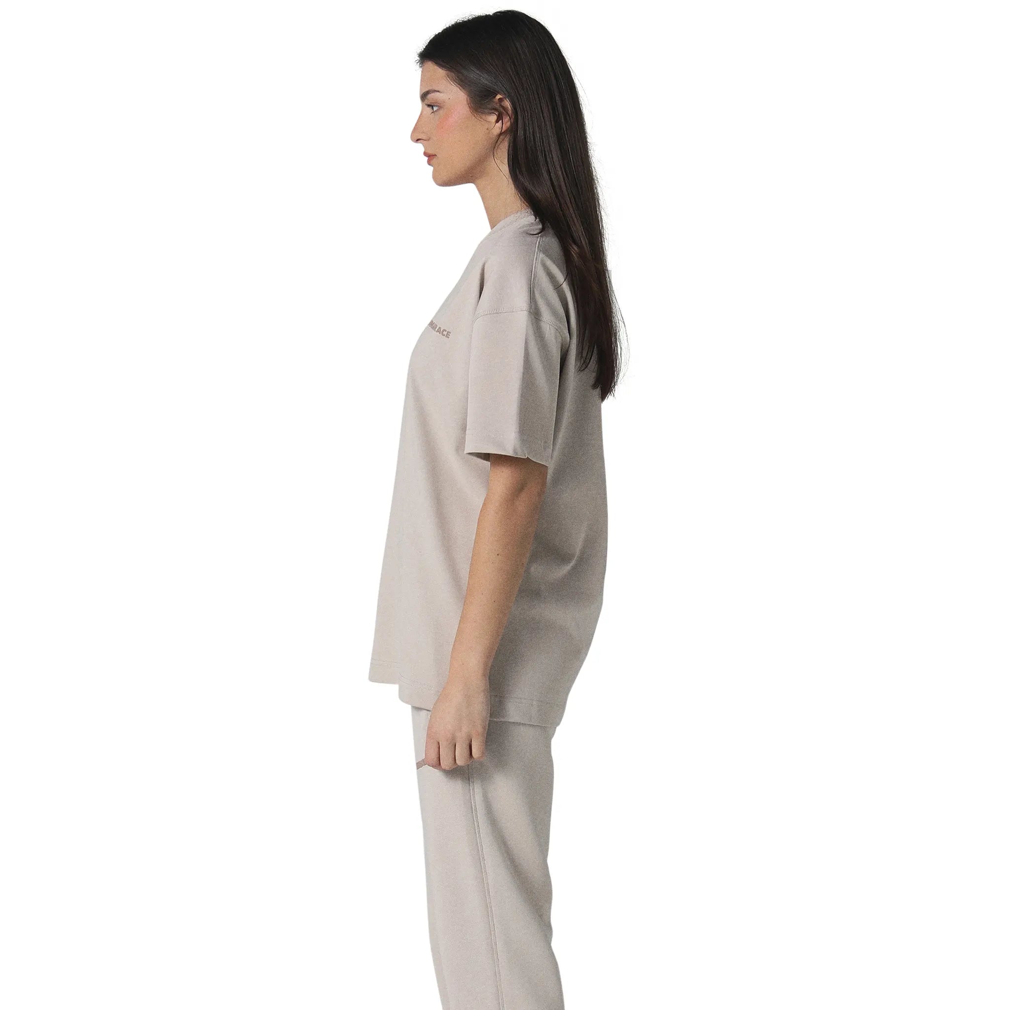Model female side view of Human Race Space Deep Taupe T Shirt