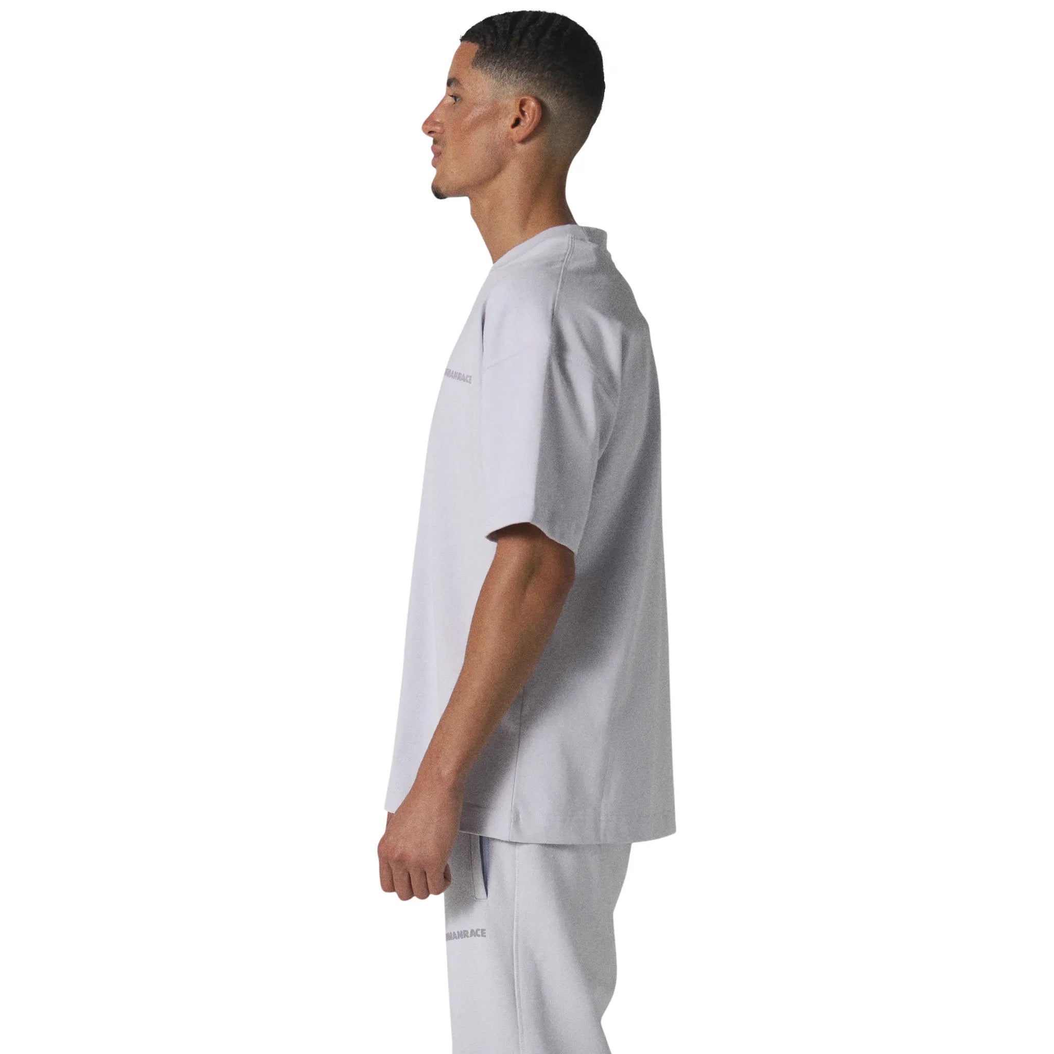 Model side view of Human Race Space Orchid Purple T Shirt