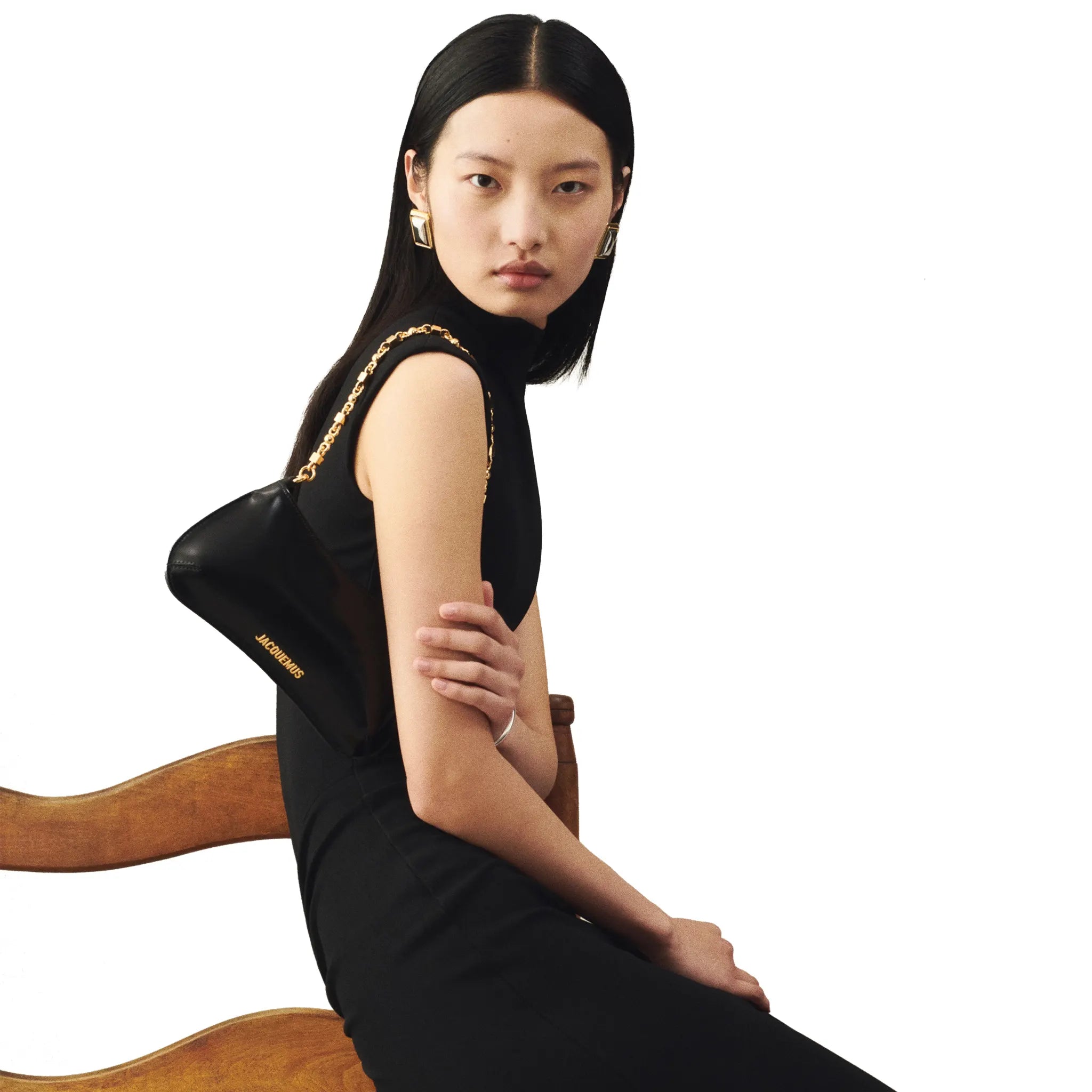 Model View of Jacquemus The Small Bisou Chain Small Black Shoulder Bag BAW00404AC18A01990