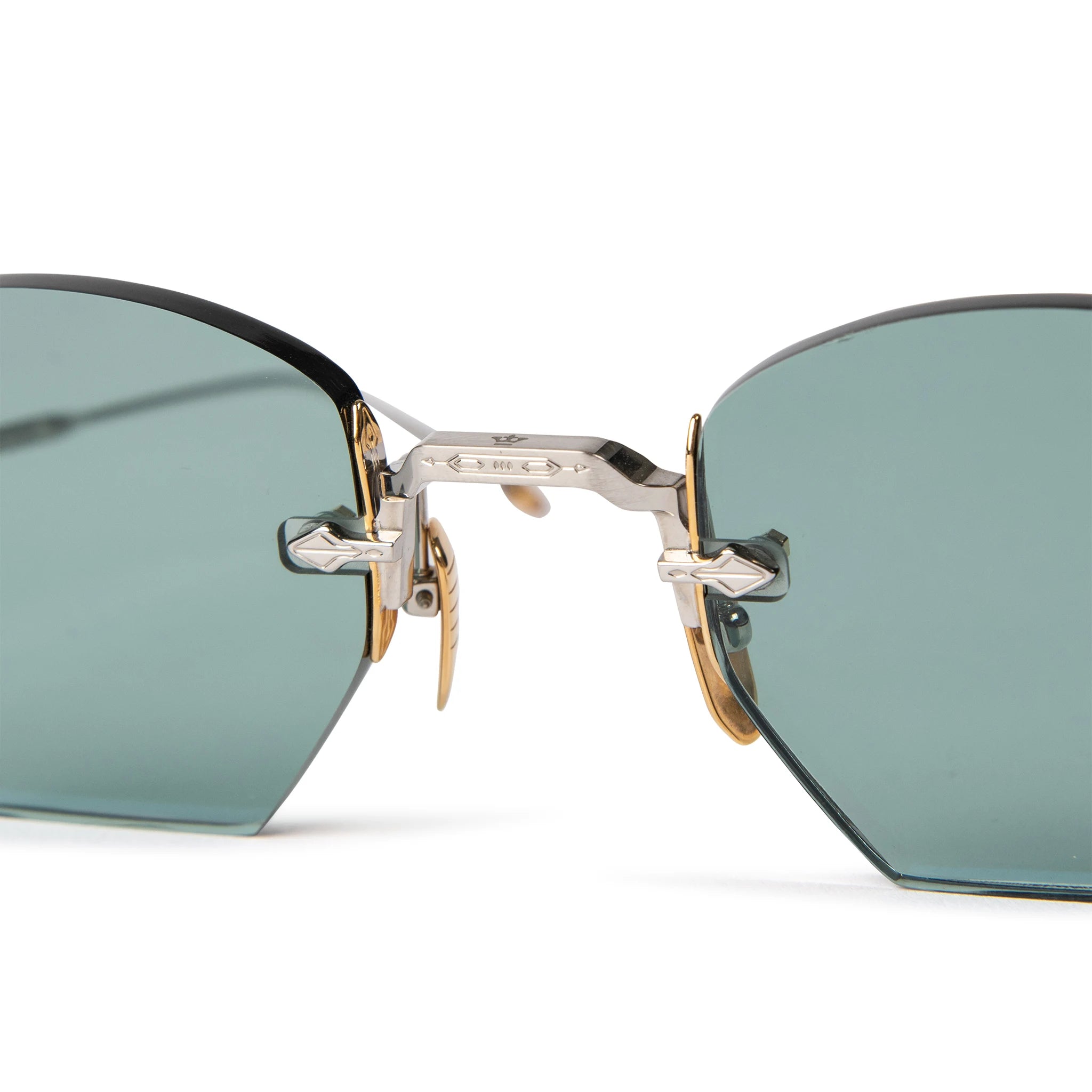 Front nose view of Jacques Marie Mage Oatman Silver Gold Green Sunglasses