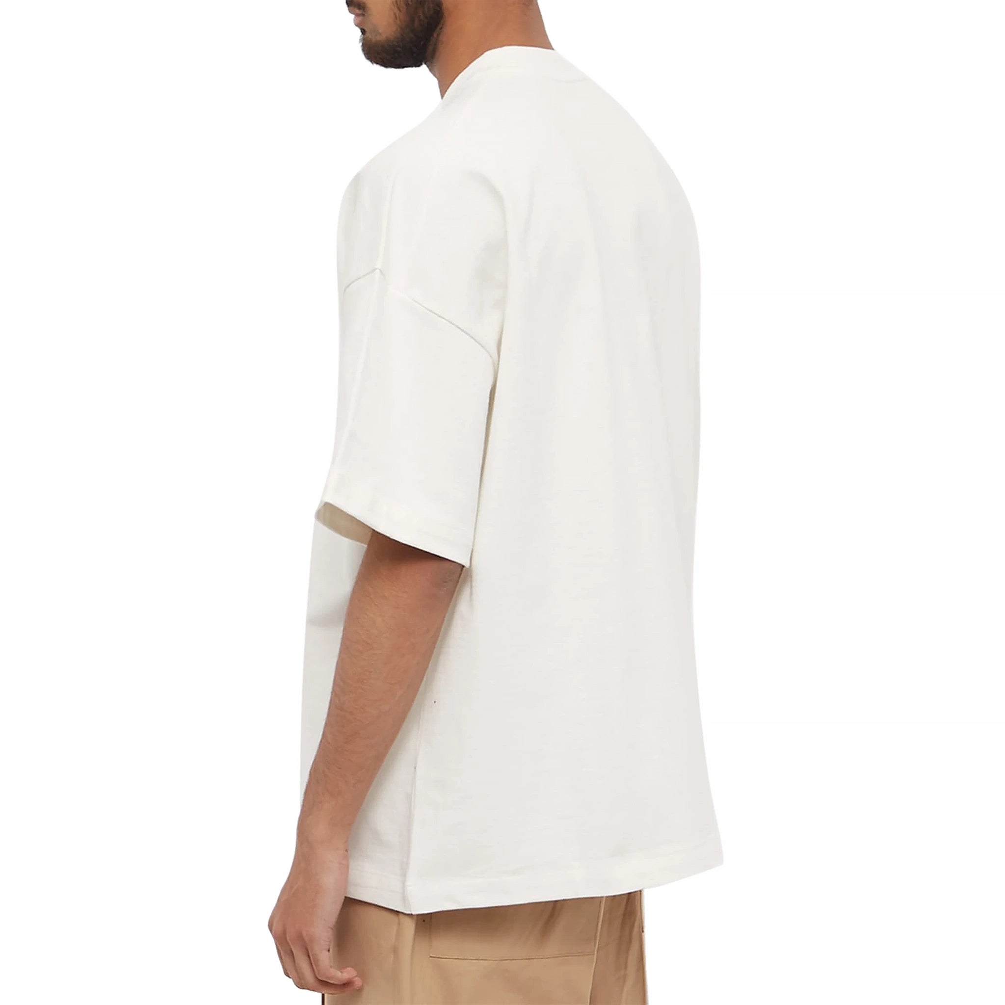 Model back view of Jil Sander Logo Printed Cosmic Latte T Shirt J21GC0001J45148102