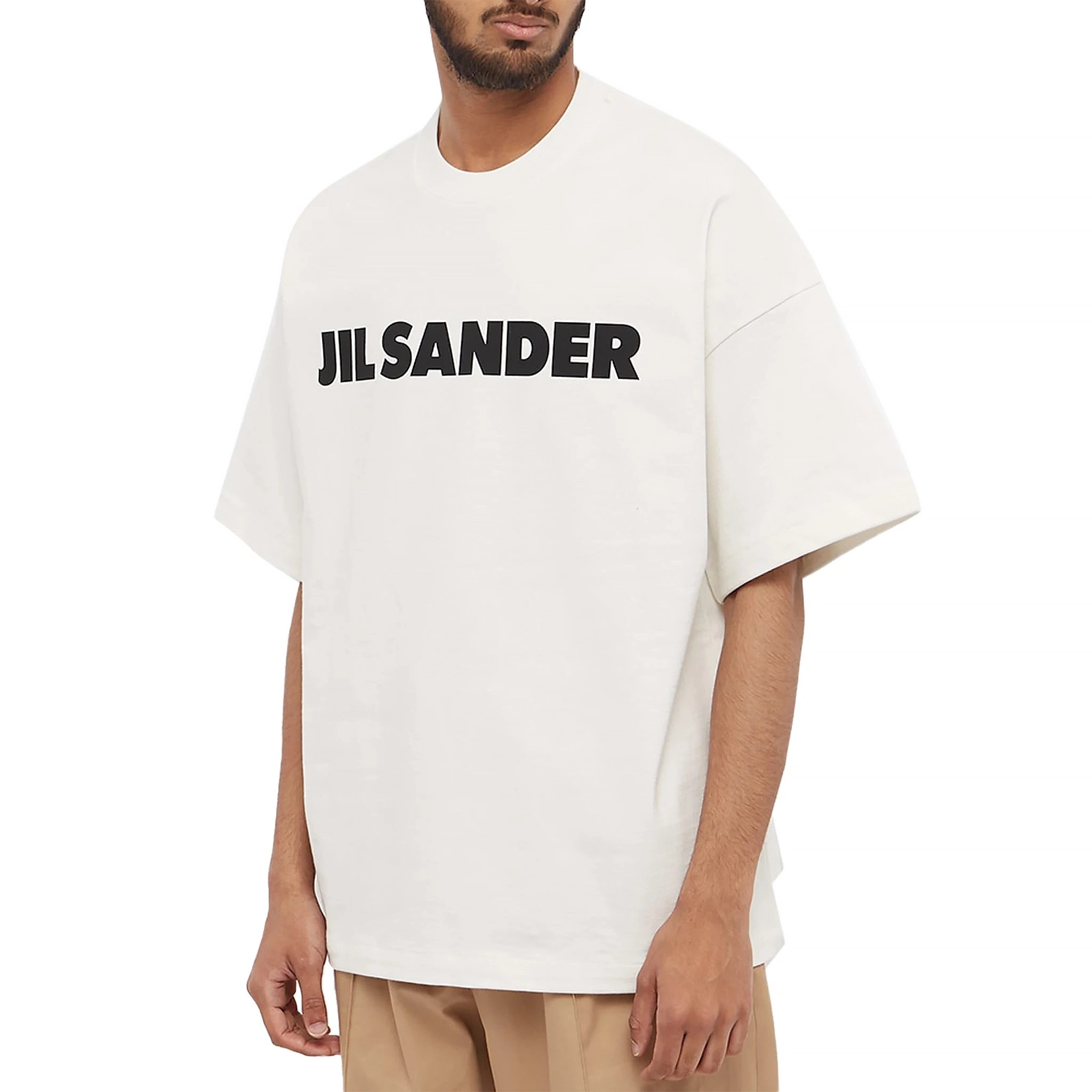 Model front view of Jil Sander Logo Printed Cosmic Latte T Shirt J21GC0001J45148102
