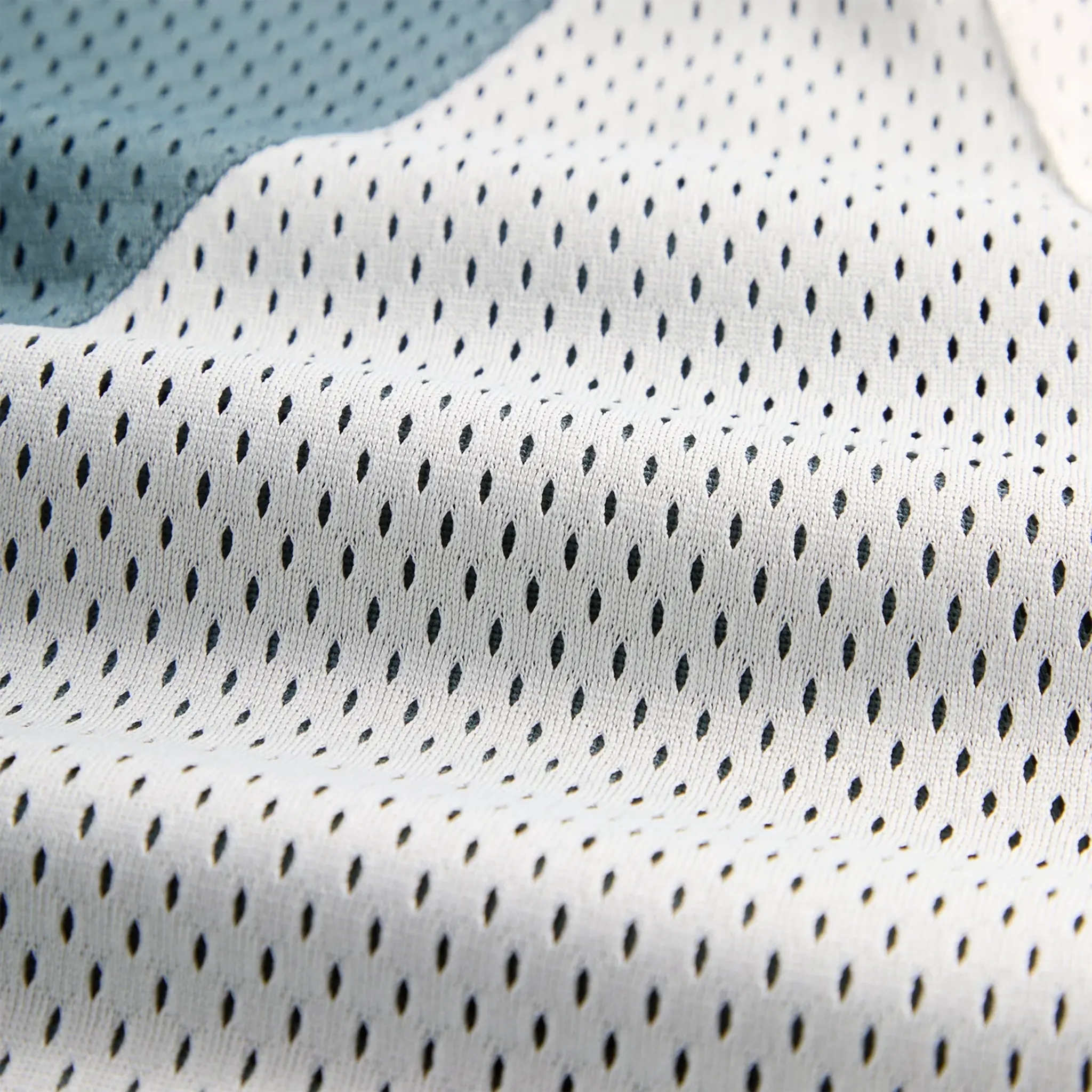 Close up view of Kith Mesh Turbo Shorts Wilde