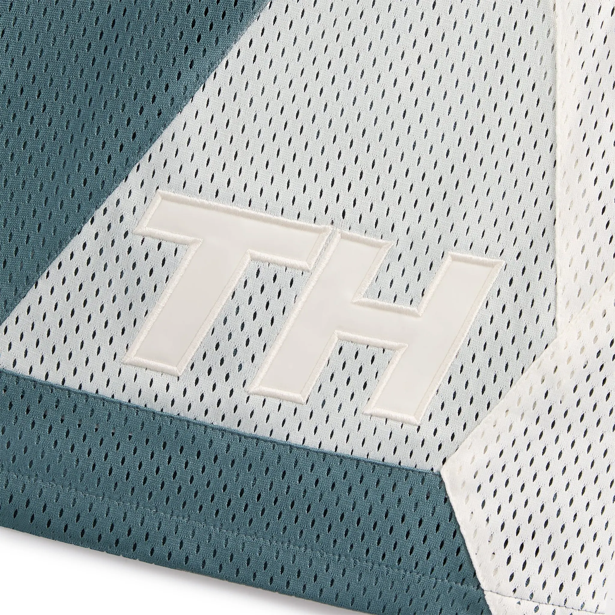 Close up view of Kith Mesh Turbo Shorts Wilde