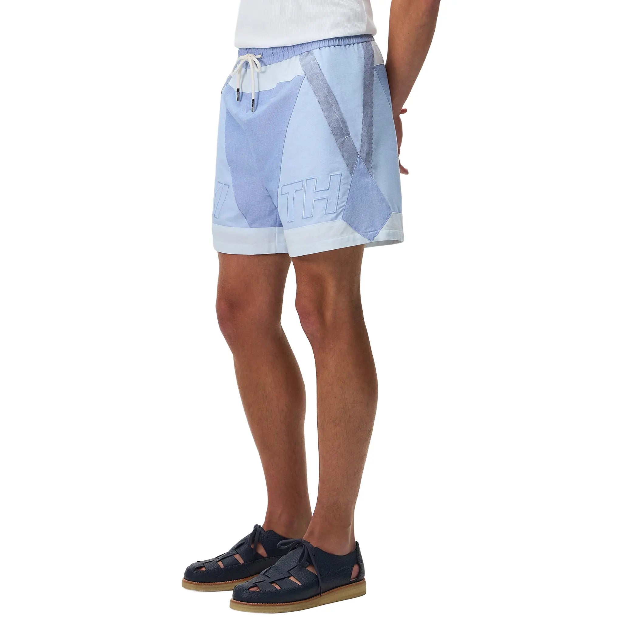Model Front Side View of Kith Oxford Turbo Milky Way Shorts KHM061405-471