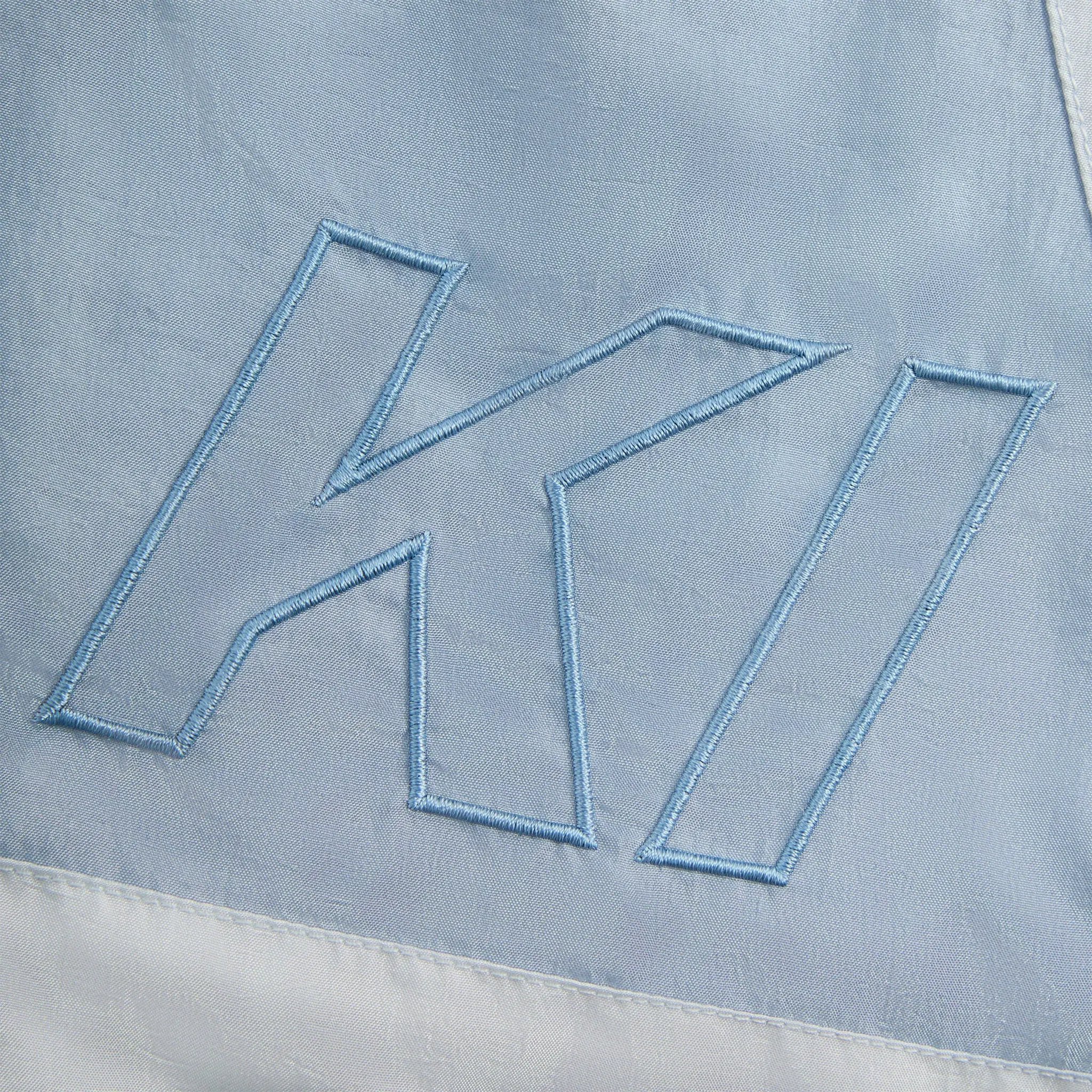 Logo Detailed View of Kith Washed Turbo Analysis Shorts