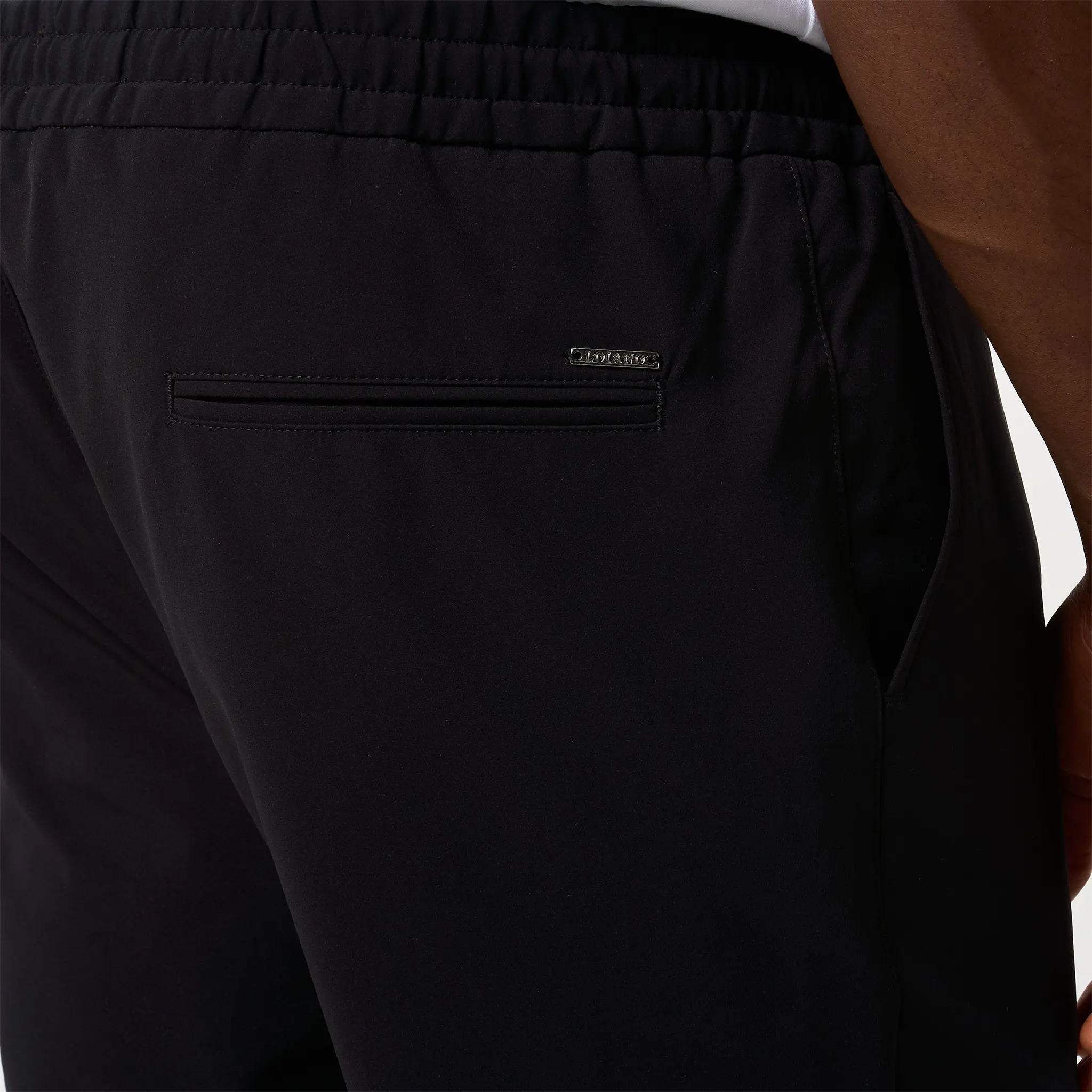Detailed Back View of Loiano Tech Black Trousers