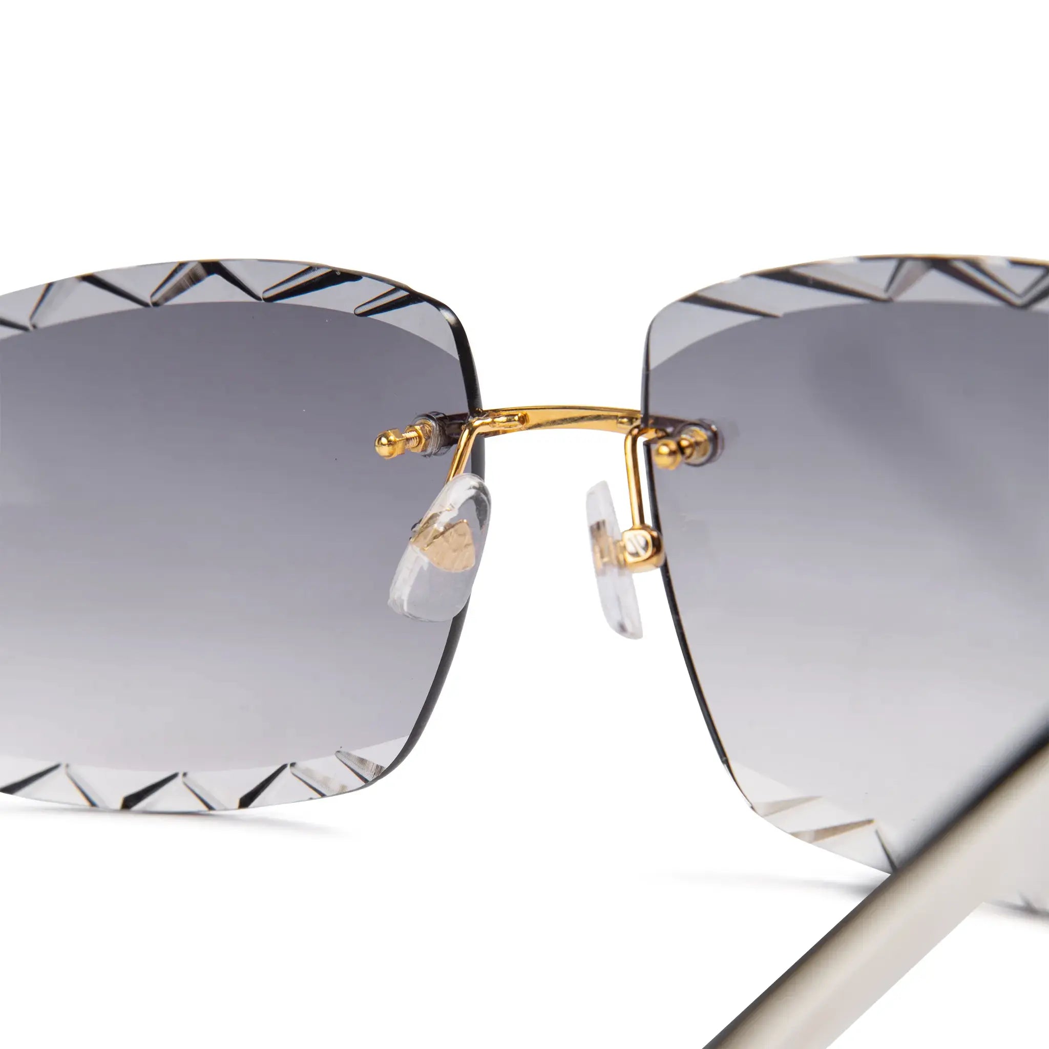 Nose bridge view of Maybach Eyewear The Artist III G-HAS-ZZ5 Custom Gold Grey Fade Diamond Cut Sunglasses