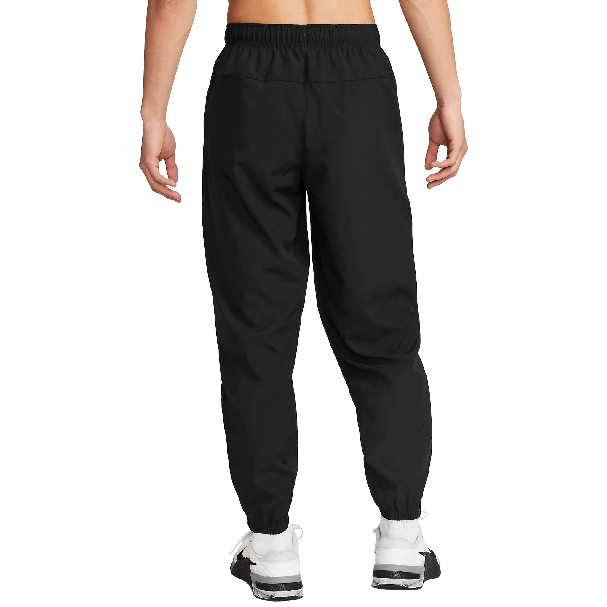 Model back view of Nike Challenger Black Pants