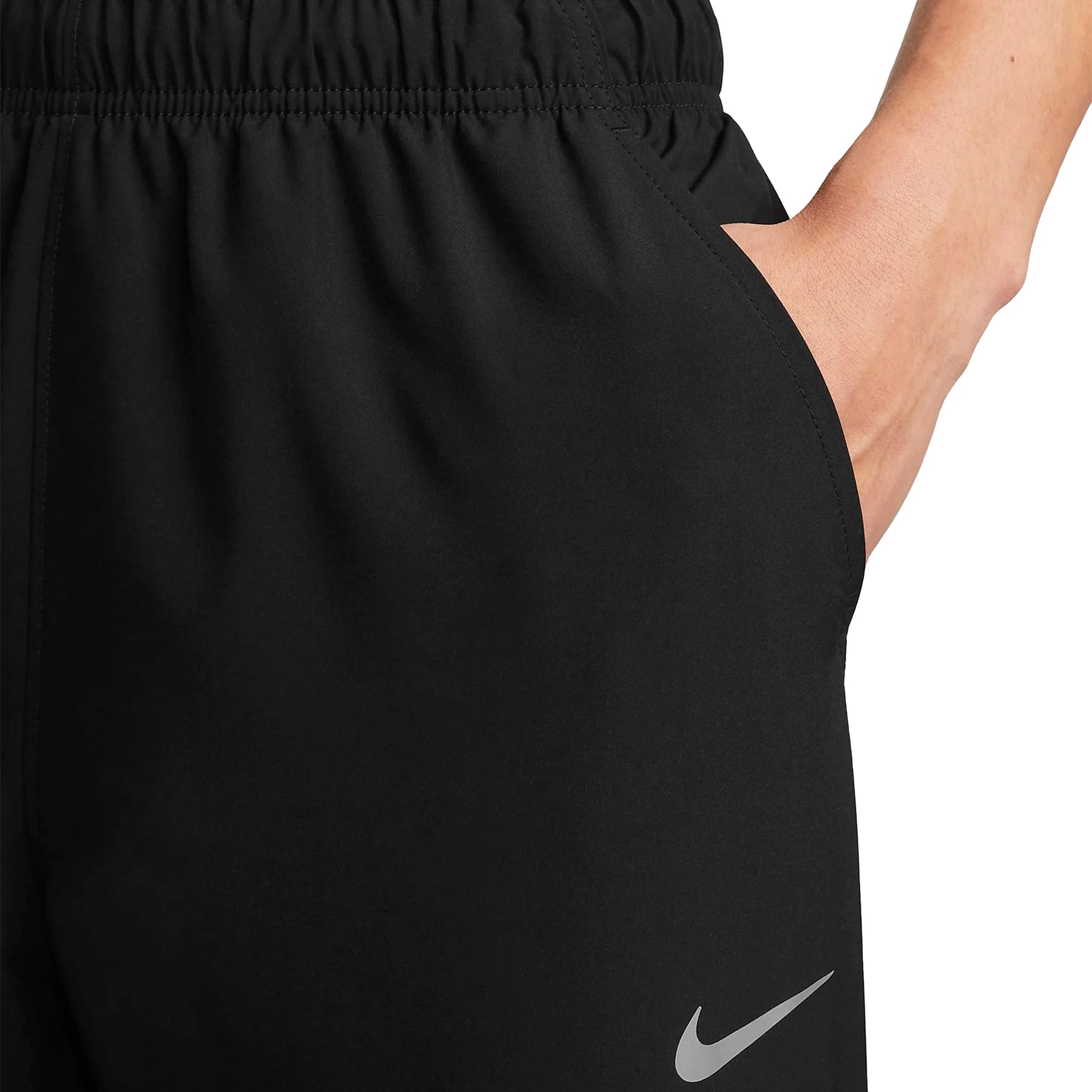 Model logo view of Nike Challenger Black Pants