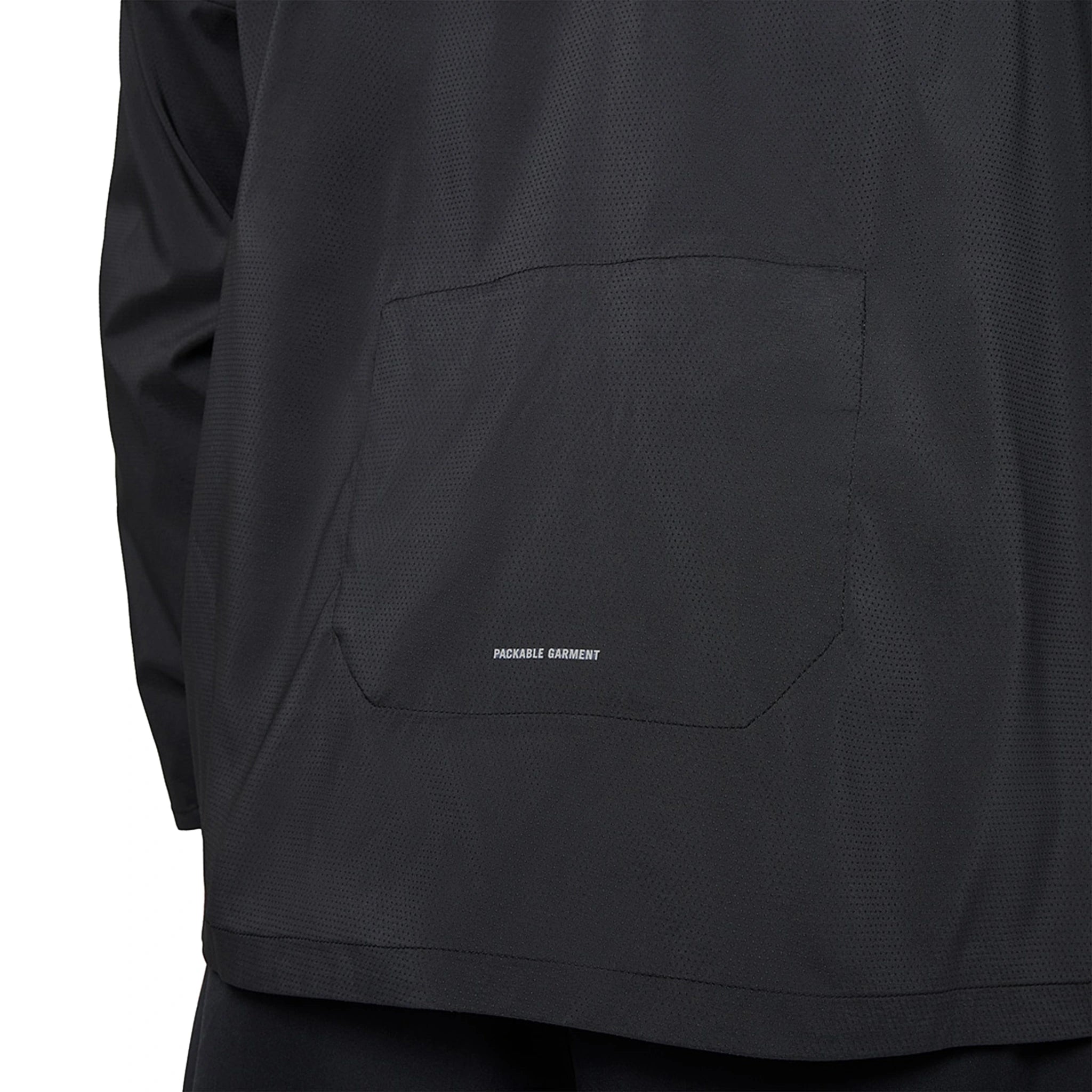 Model back pocket view of Nike Repel Packable Black Windrunner Jacket CZ9071-010