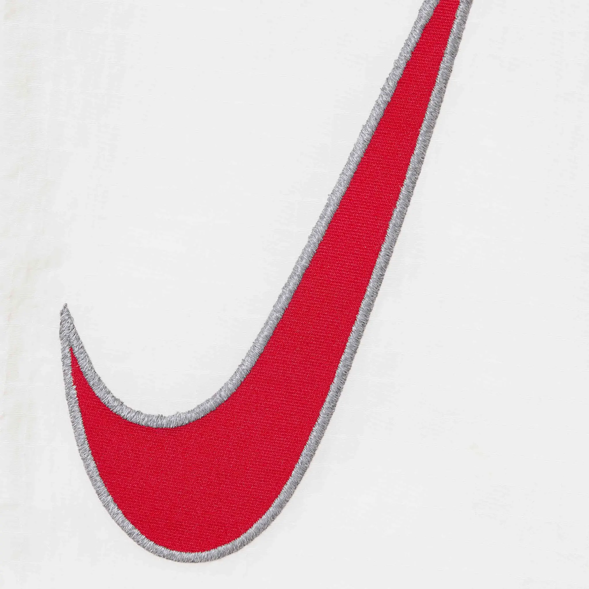 Detail view of Nike Supreme Ripstop White Track Pants