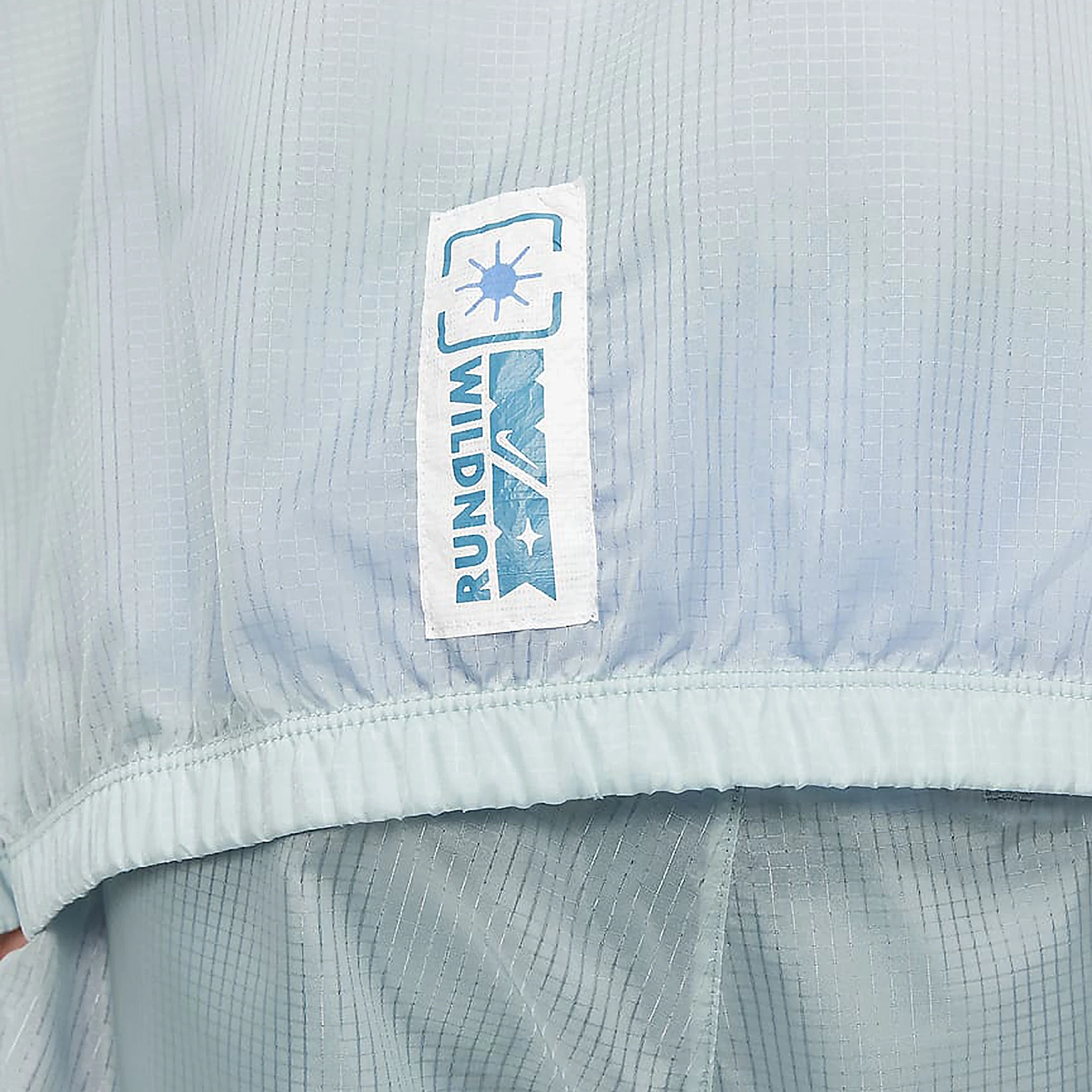 Side tab view of Nike Wild Run Windrunner Blue Jacket DD5392-366