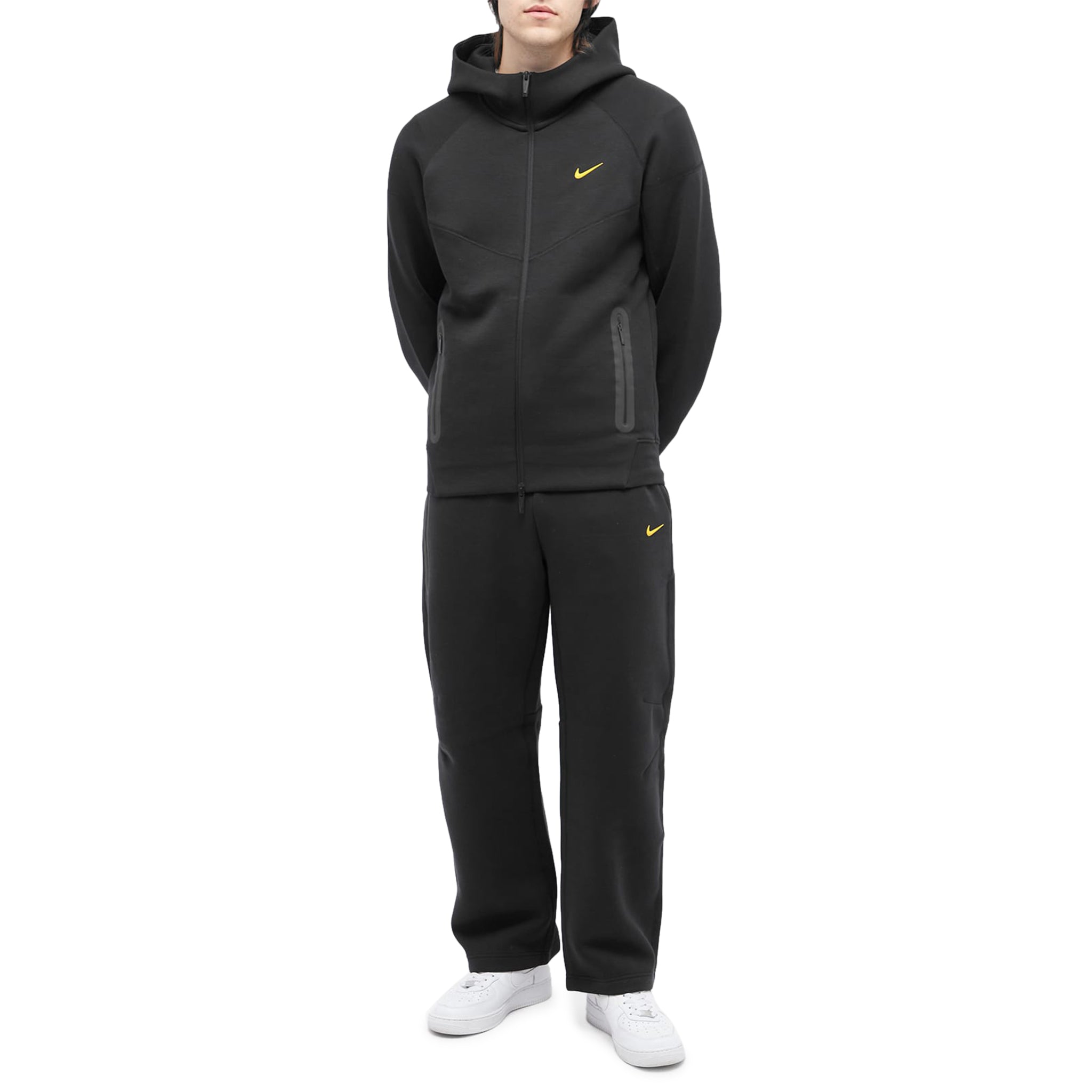 Model full view of nike x nocta tech fleece black zip-up hoodie fd8453-010
