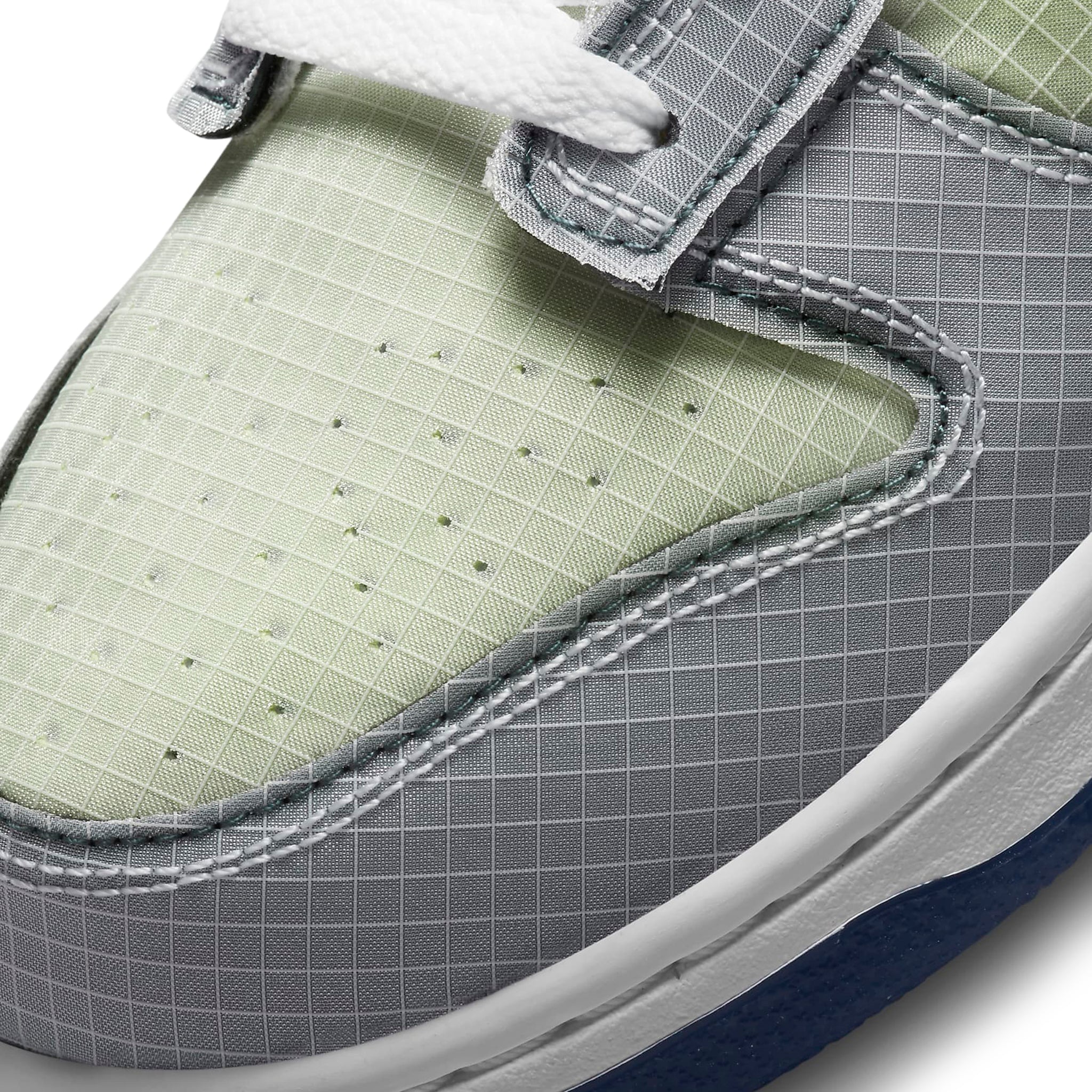 Toe box view of Nike x Union Dunk Low Passport Pack Pistachio DJ9649-401