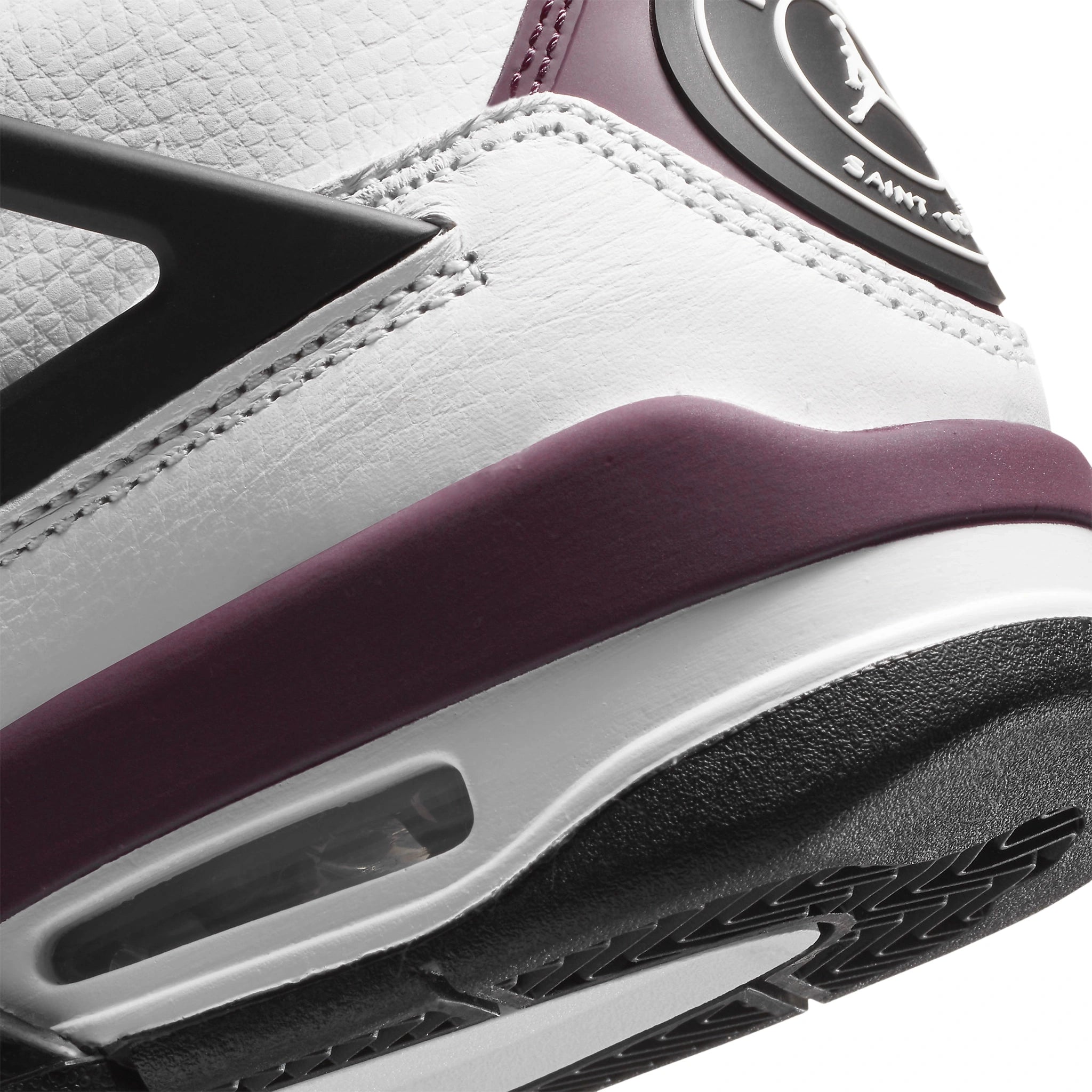 Heel view of Paris Saint-Germain x Air Jordan 4 Retro Bordeaux (GS) CZ6509-100