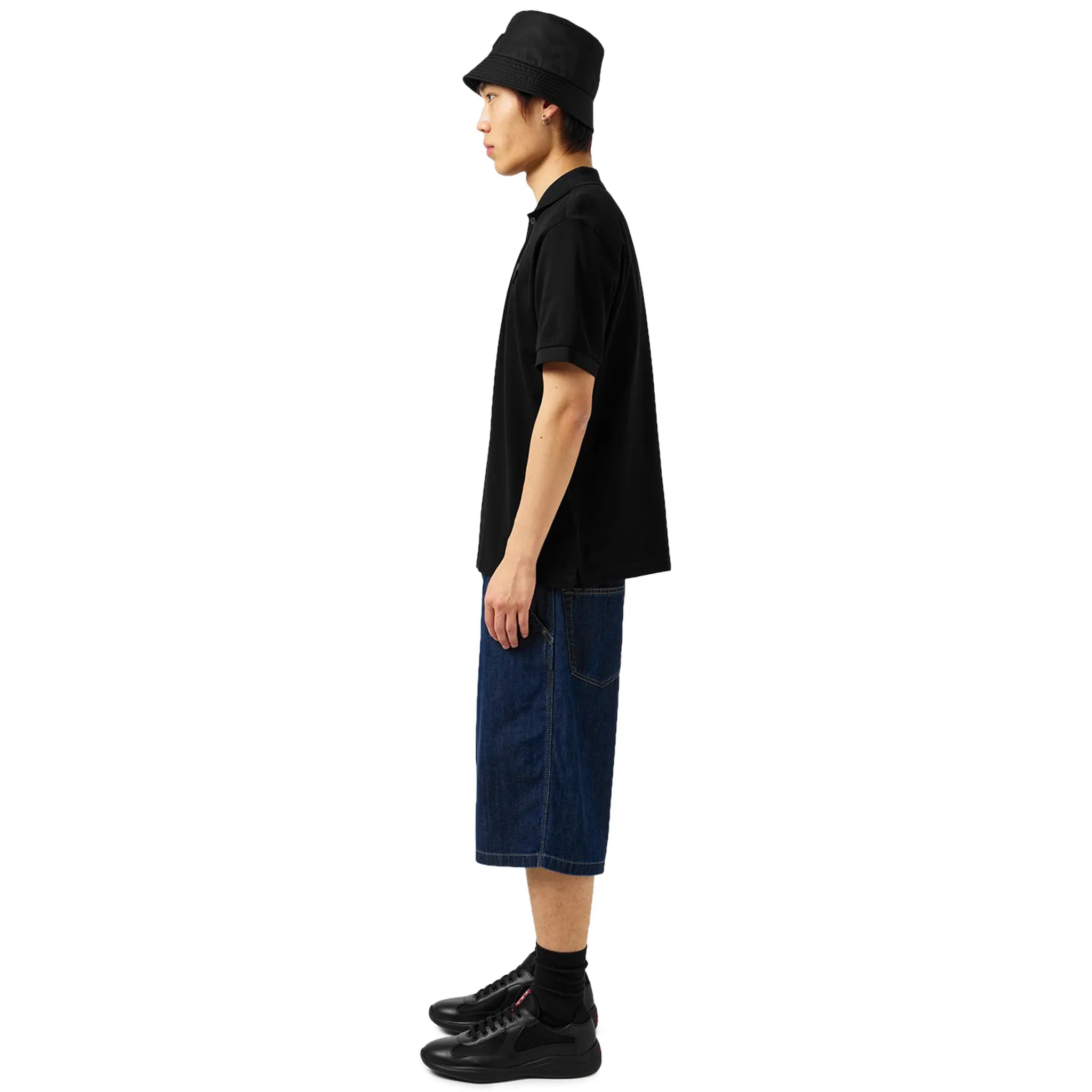 Model side view of Prada Americas Cup Black Sneaker