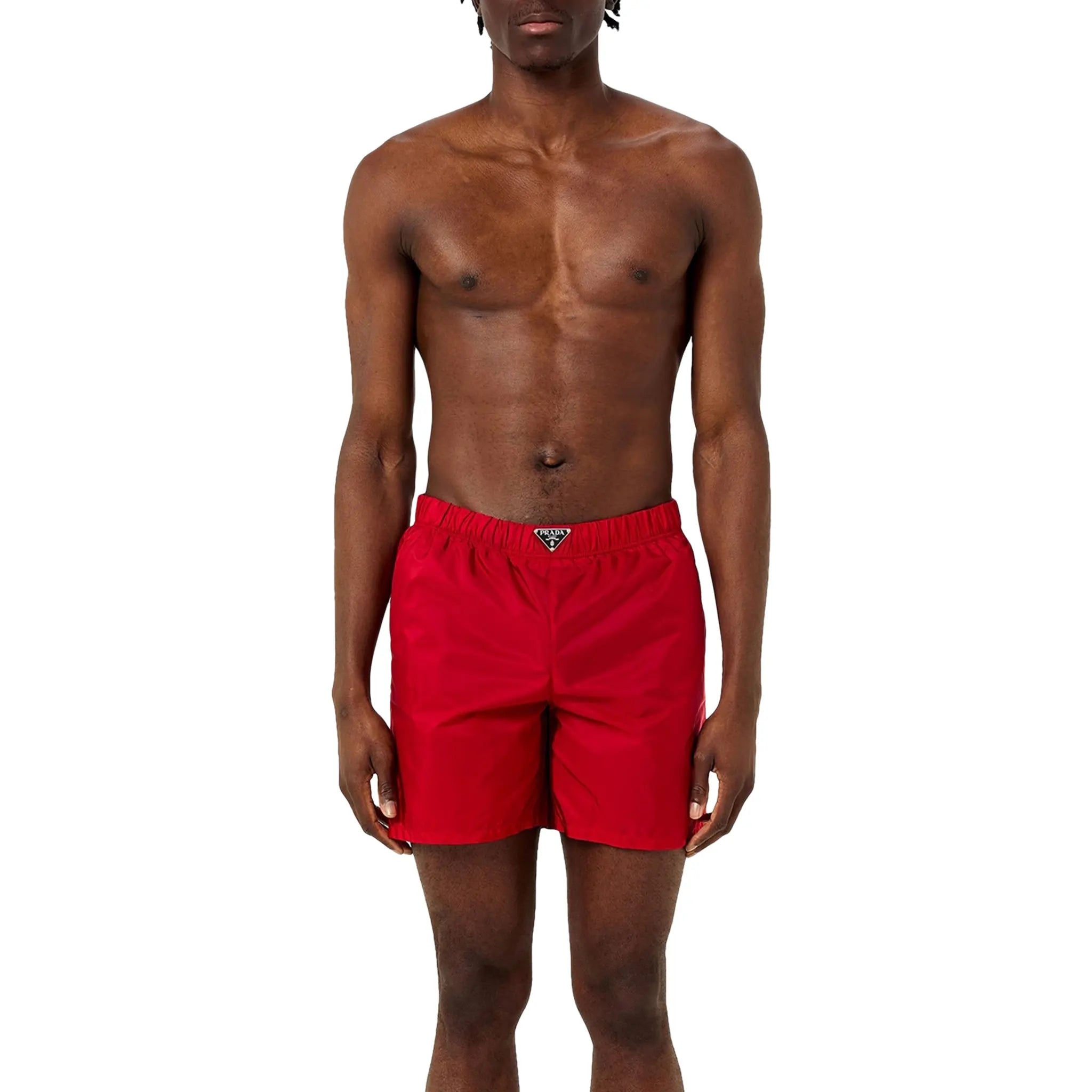 Model Front view of Prada Triangle Interlock Red Swim Shorts UB372SOOO1WQ9
