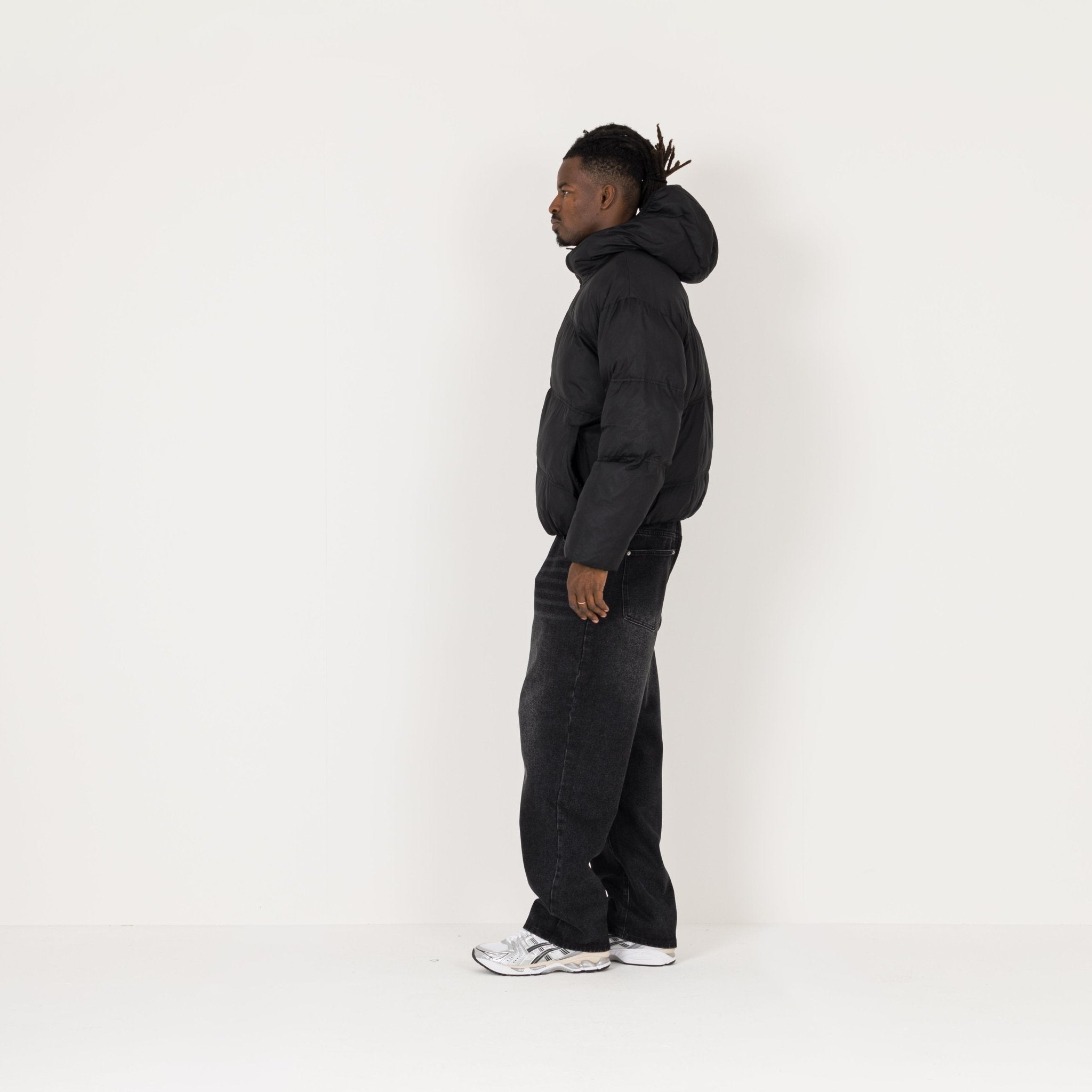 Model Side view of Destructive Insulated Black Puffer Jacket
