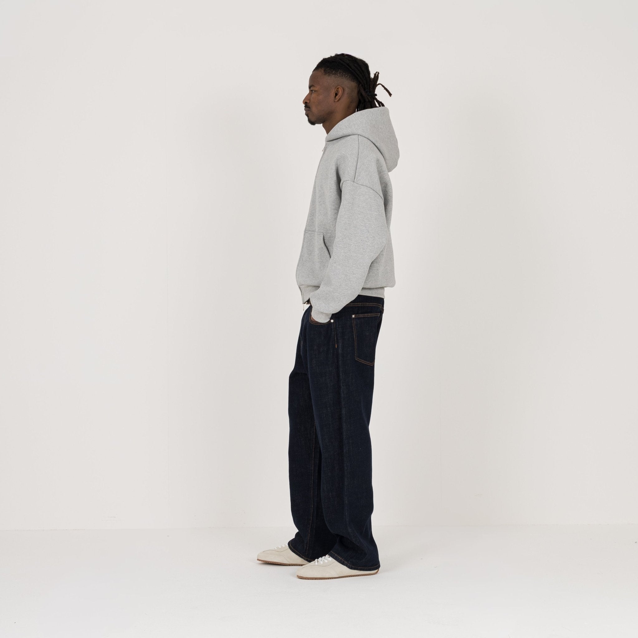 Model view of Destructive Relaxed Denim Raw Jeans