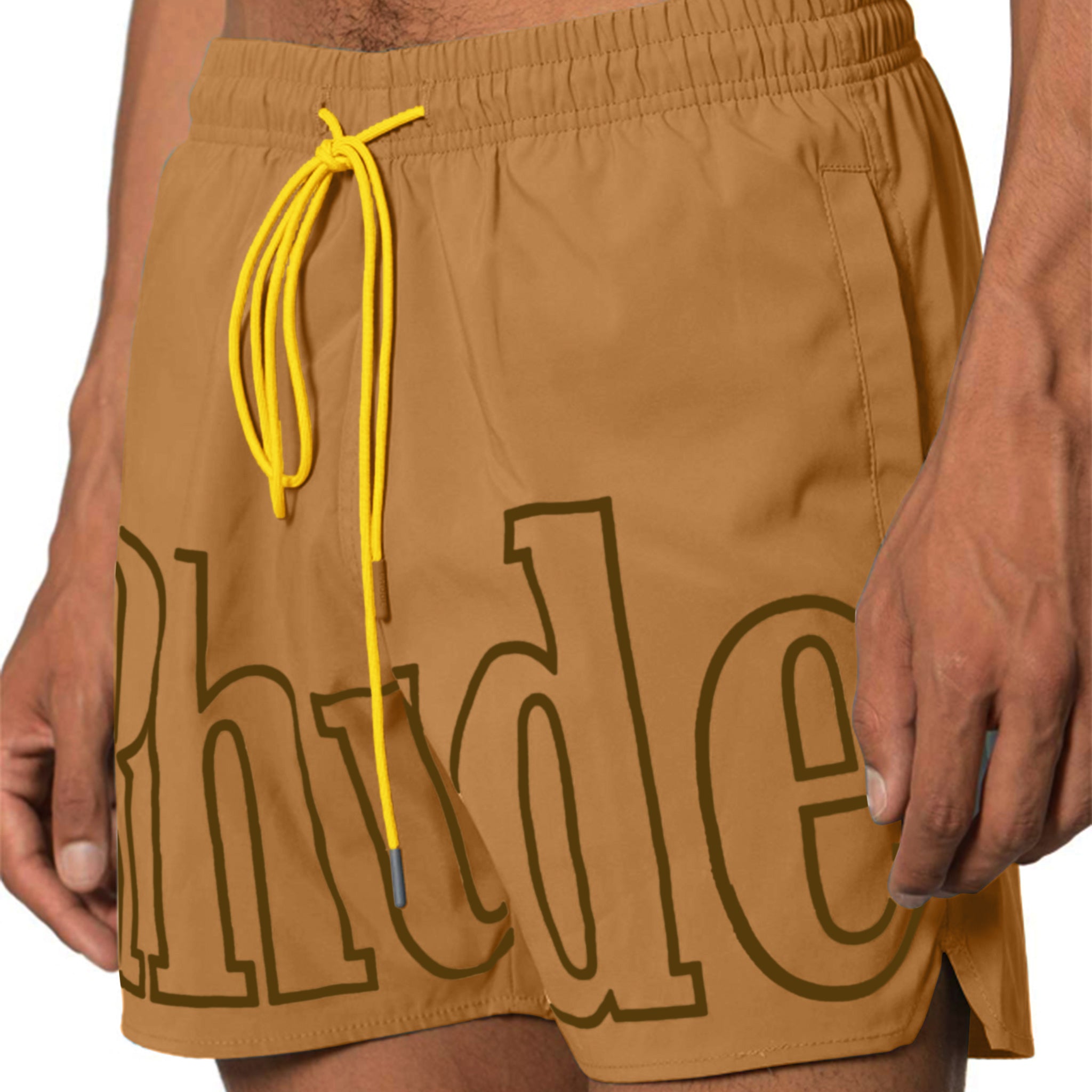 Model front view of Rhude Logo Swim Shorts Camel RHPF23SM01169003