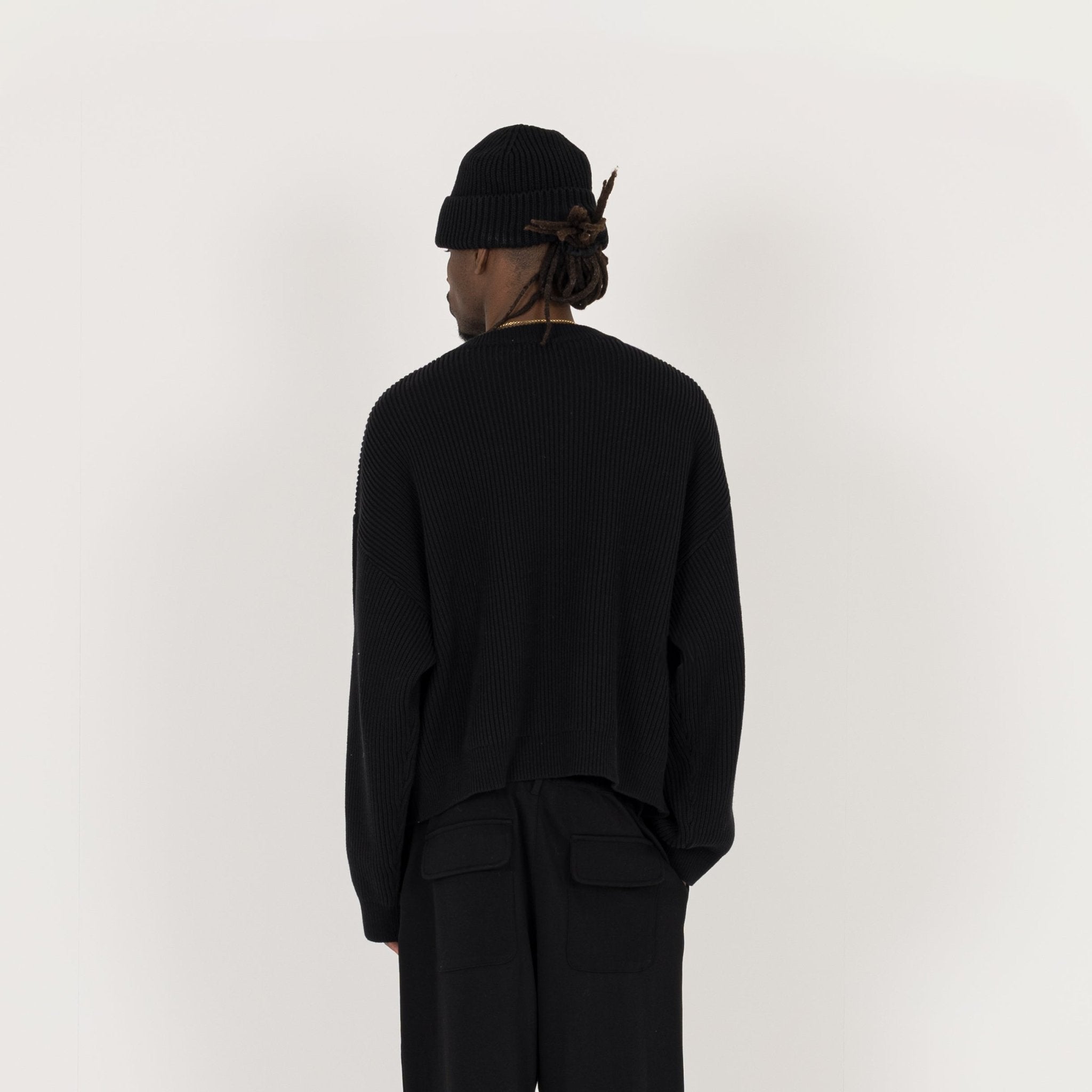 Model Back view of Destructive Ribbed Black Beanie
