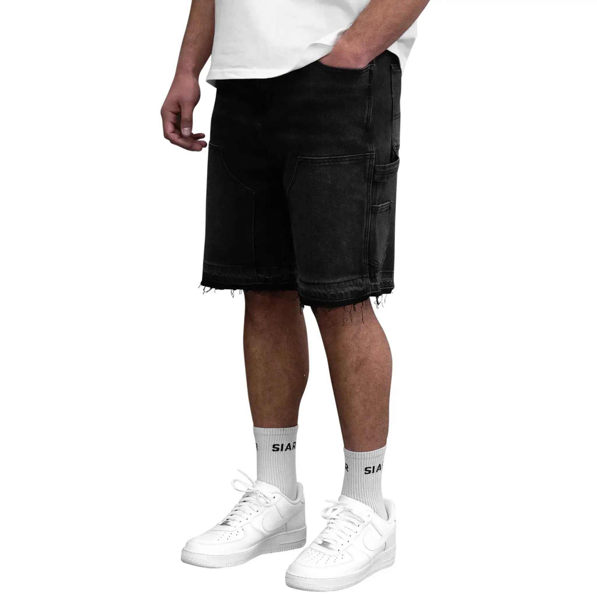 Model side view of SIARR Carpenter Shorts Black