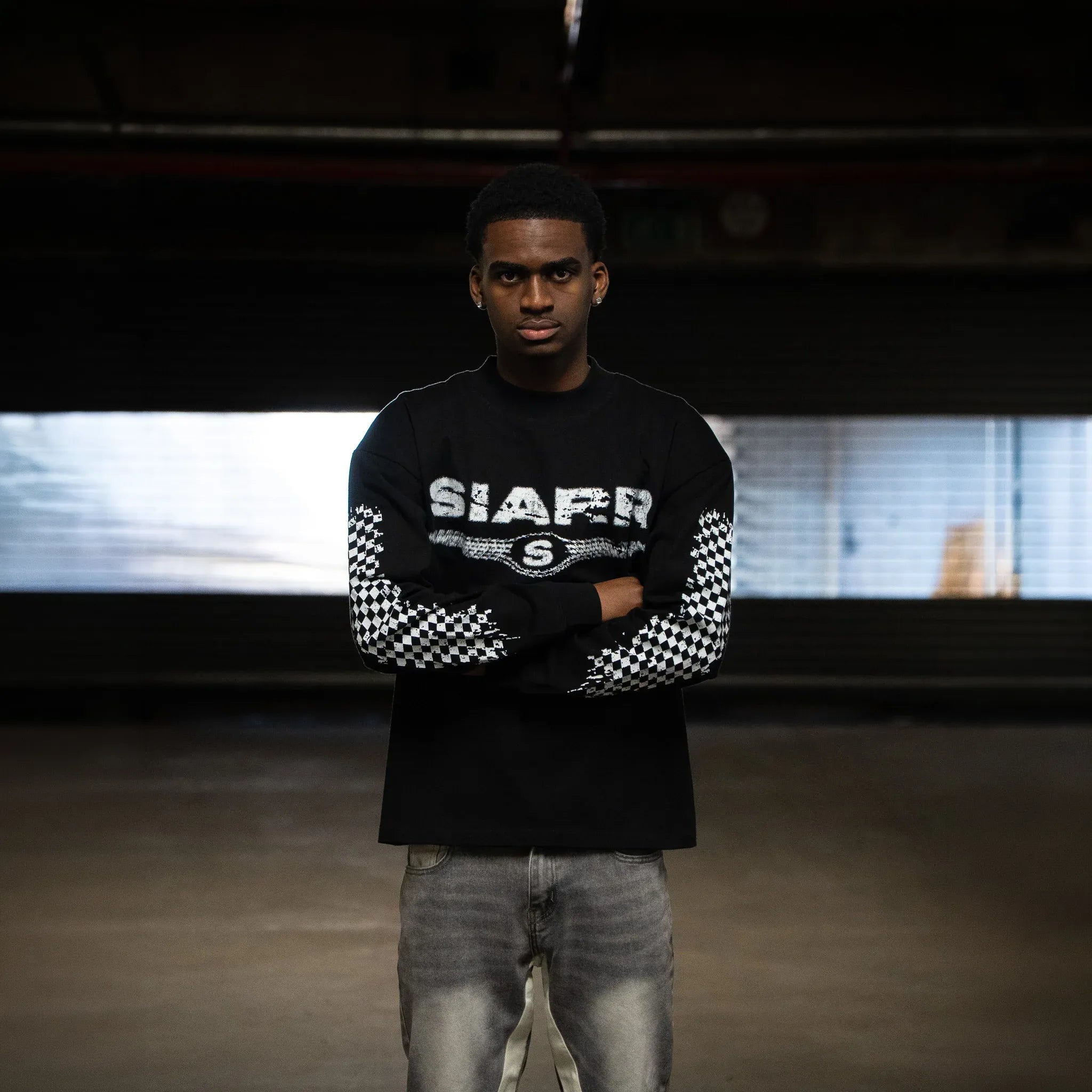 Model Front View of SIARR Chequered L/S Black T-Shirt