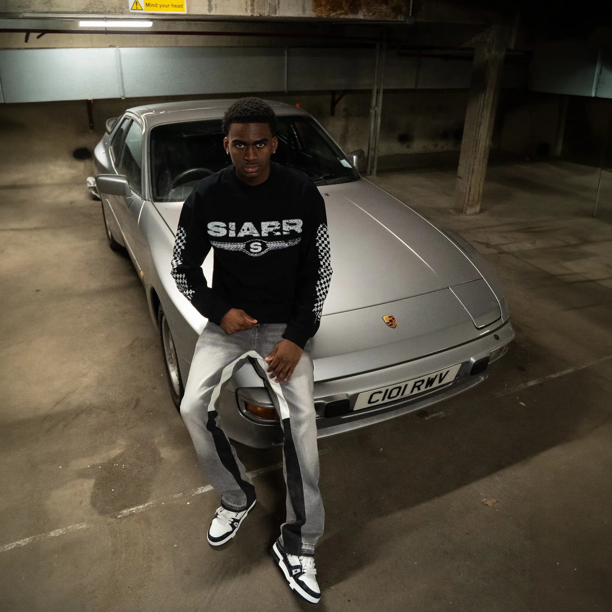 Model Front View of SIARR Chequered L/S Black T-Shirt