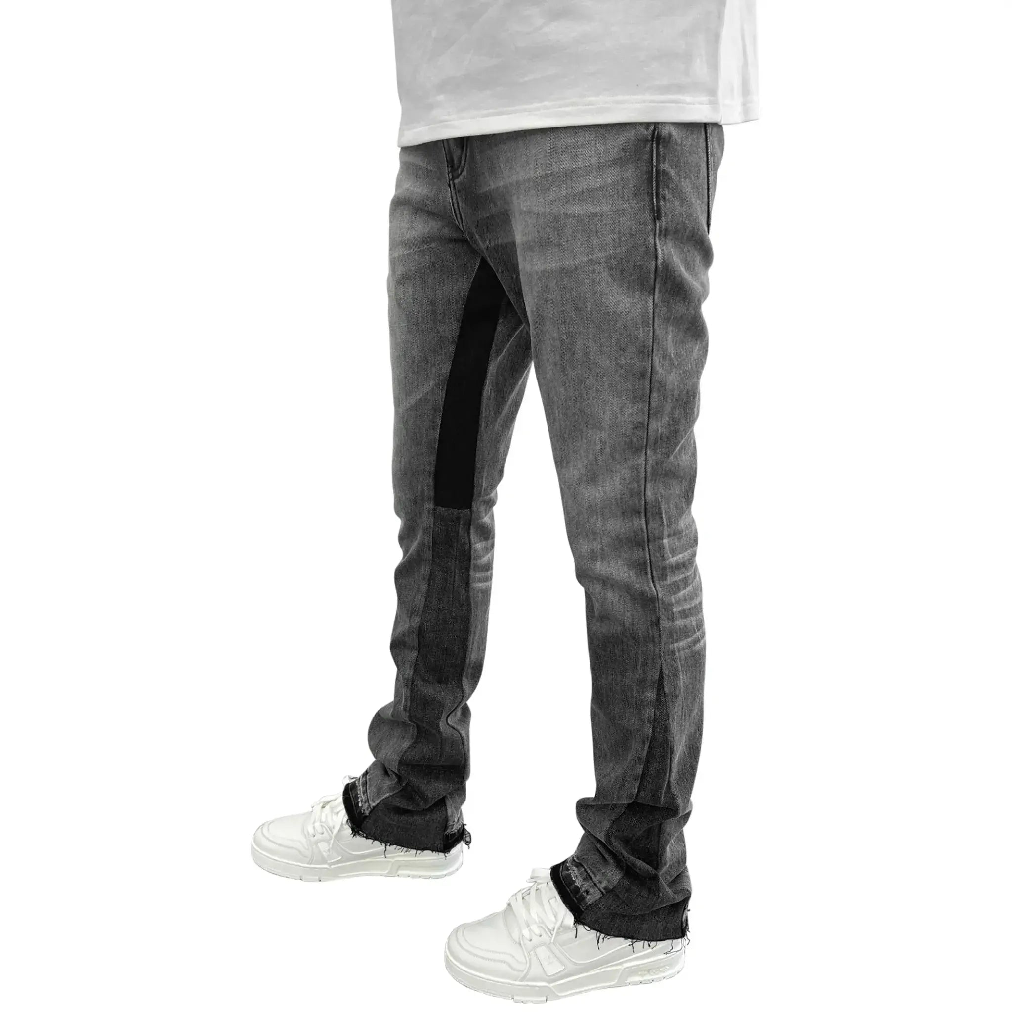 Model side view of PAIGE bootcut slim-fit jeans