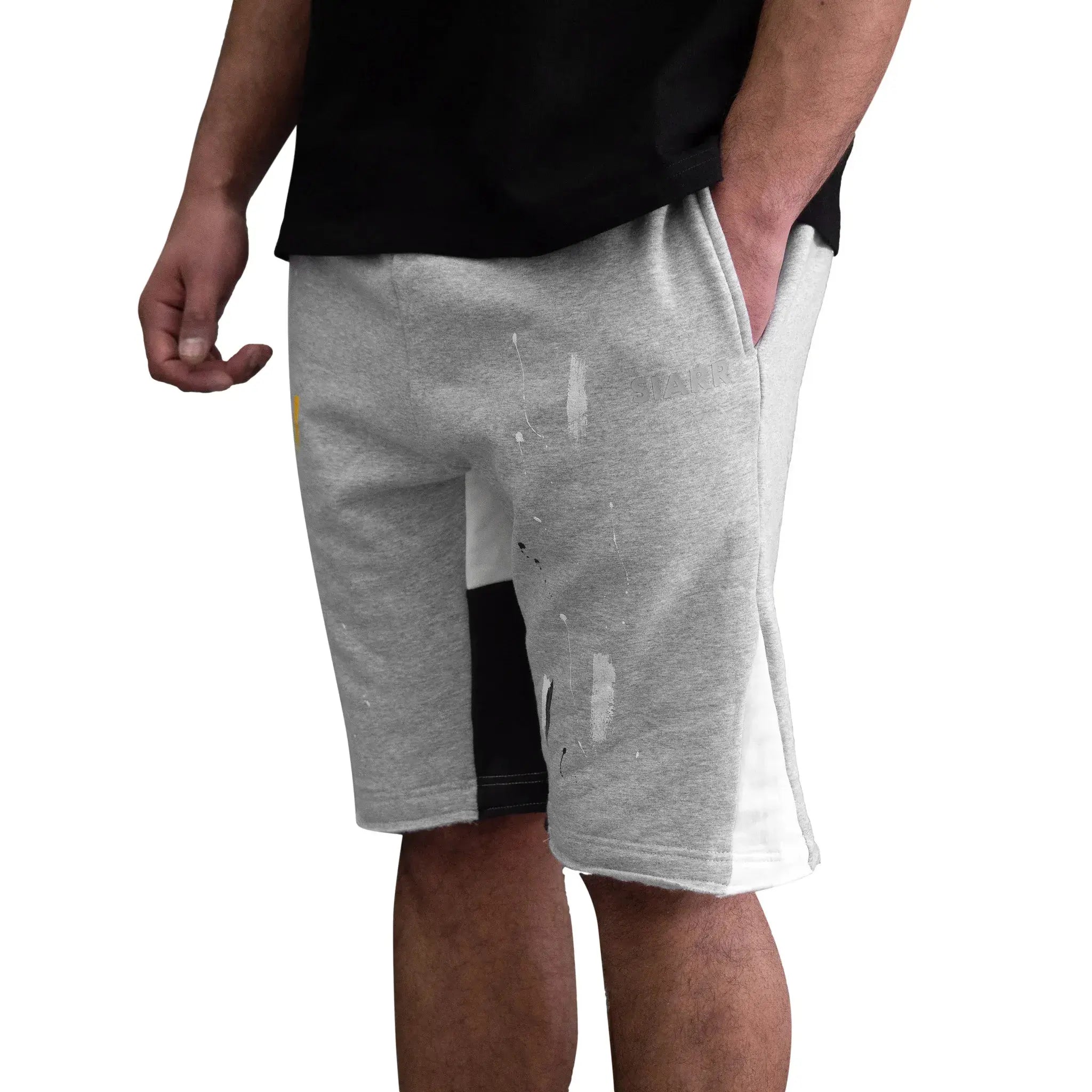 Model side view of SIARR Paint Shorts Grey