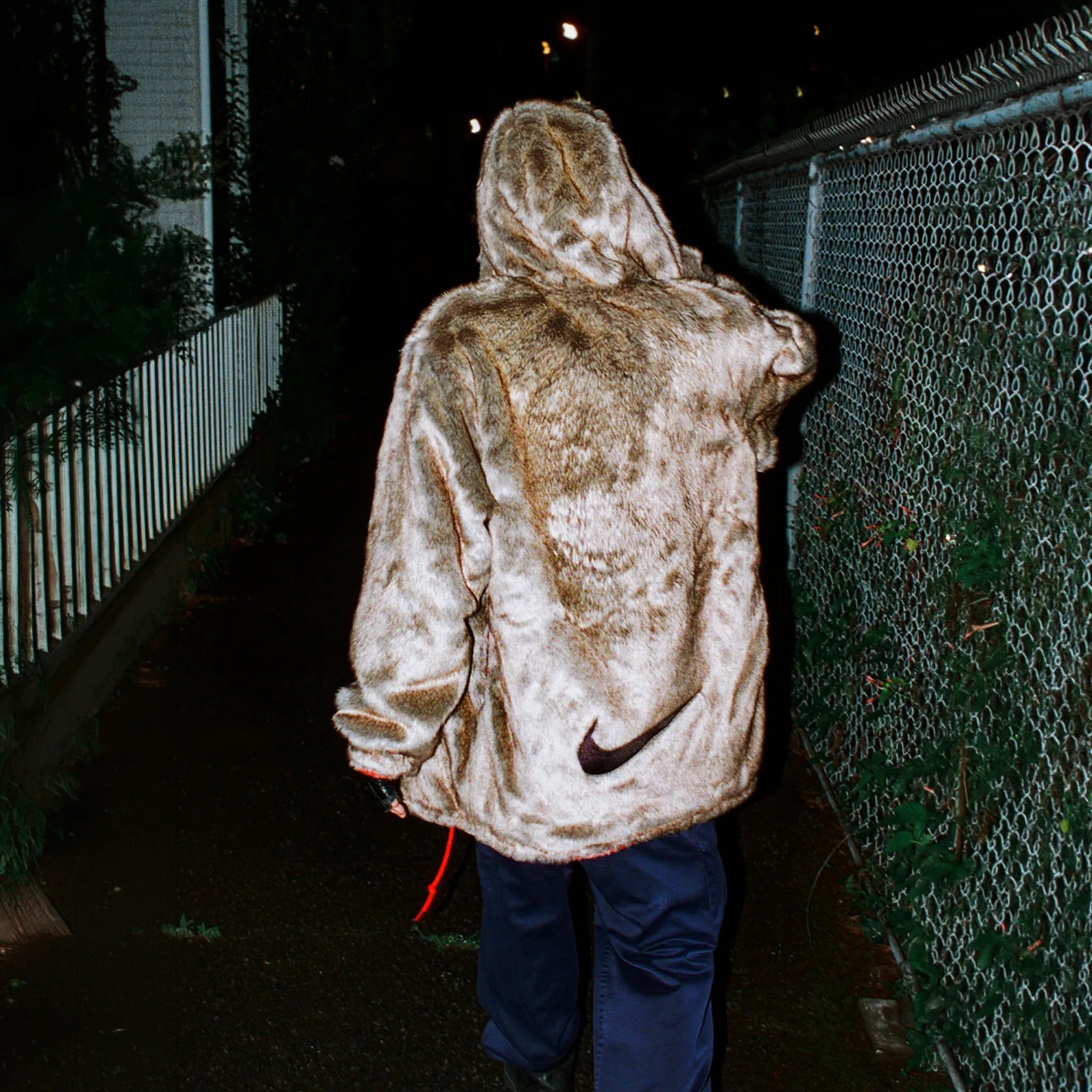 Back View of Supreme x Nike Faux Fur Reversible Parka Jacket FW26J1 RED