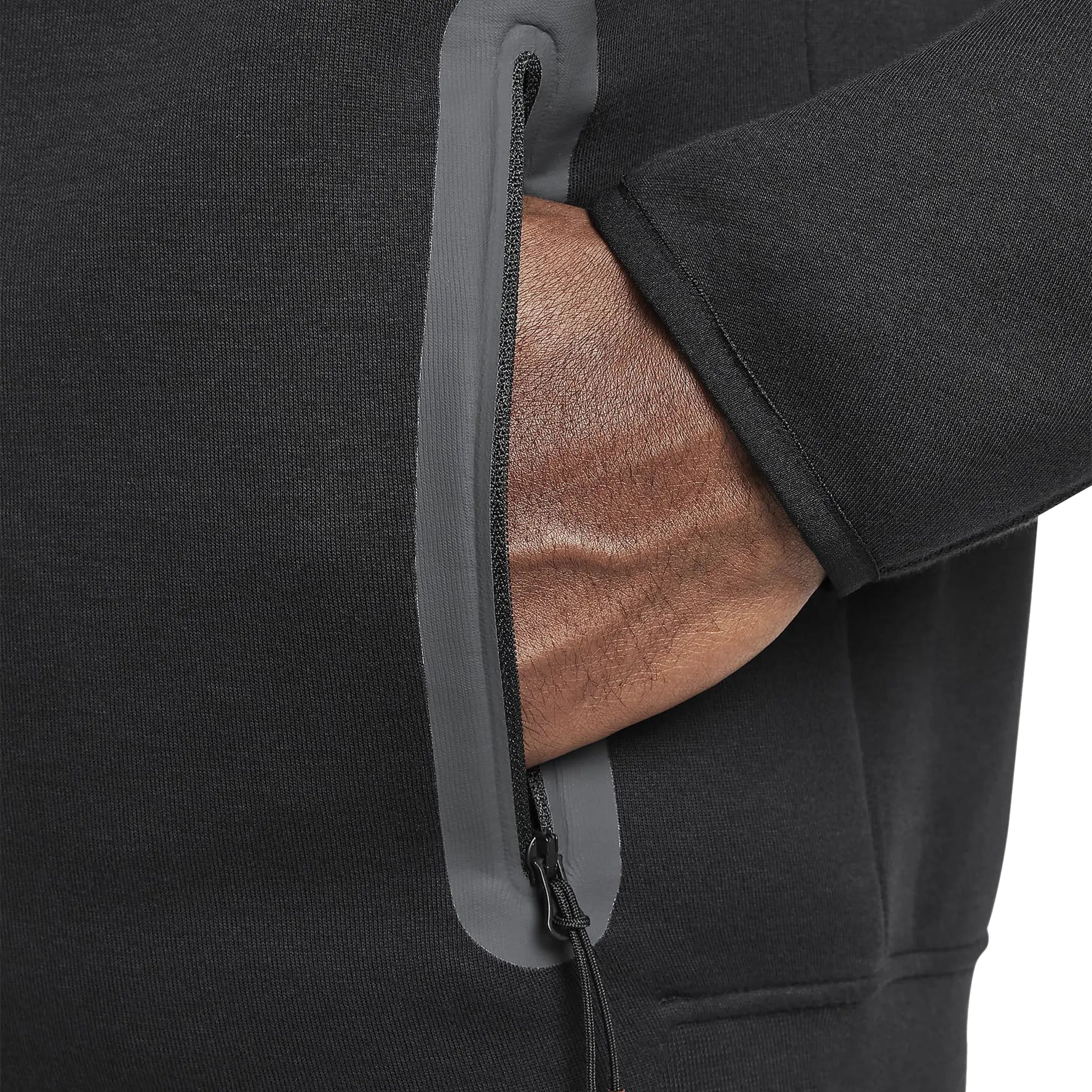 Model hoodie pocket view of Syna World x Nike Central Cee Tech Fleece Black Tracksuit HQ3748-010 | HQ3749-010