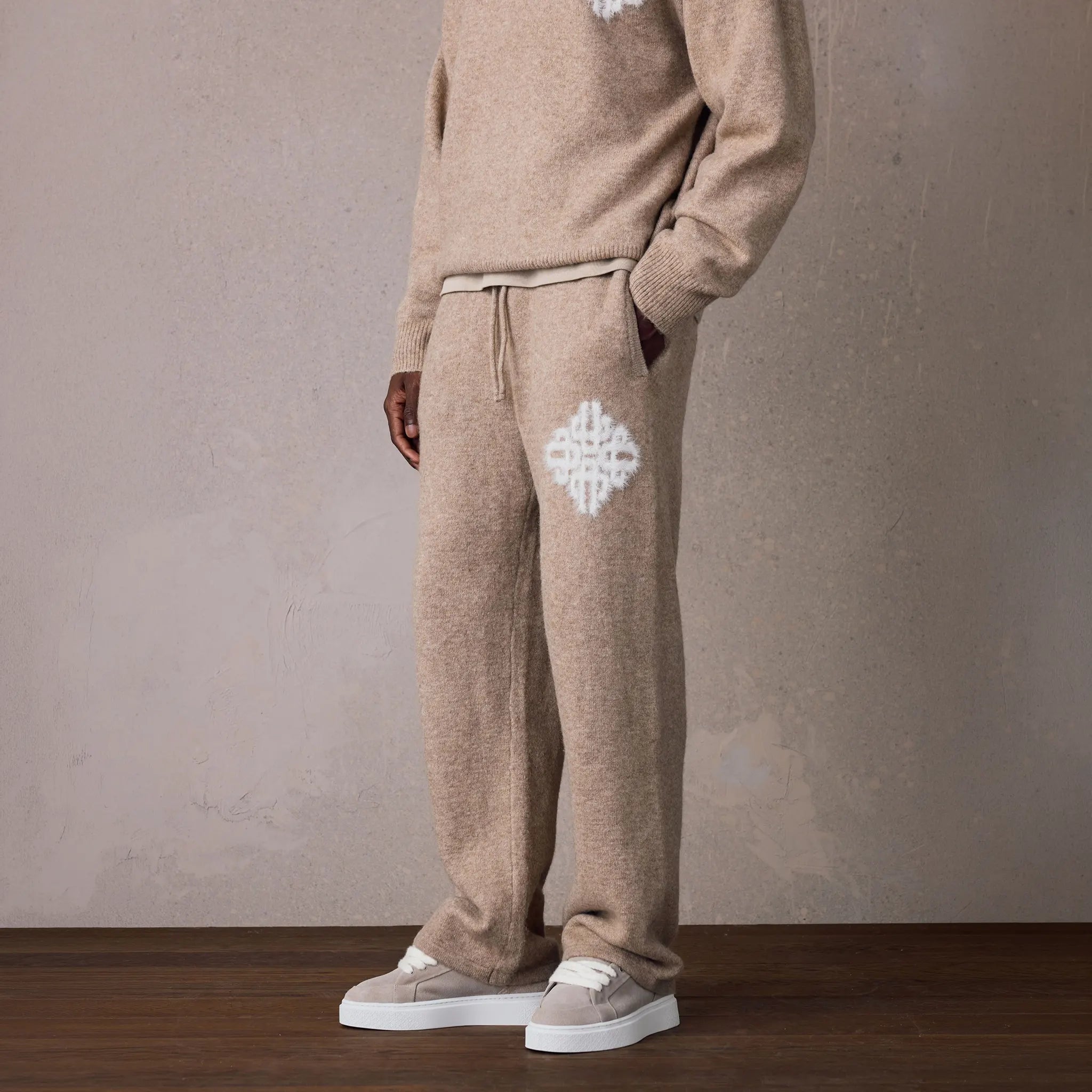 Front Side View of The Couture Club Emblem Fluffy Knit Beige Sweatpants