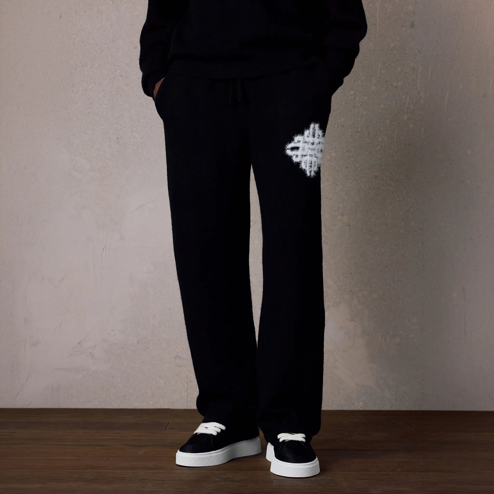 Detailed View of The Couture Club Emblem Fluffy Knit Black Sweatpants