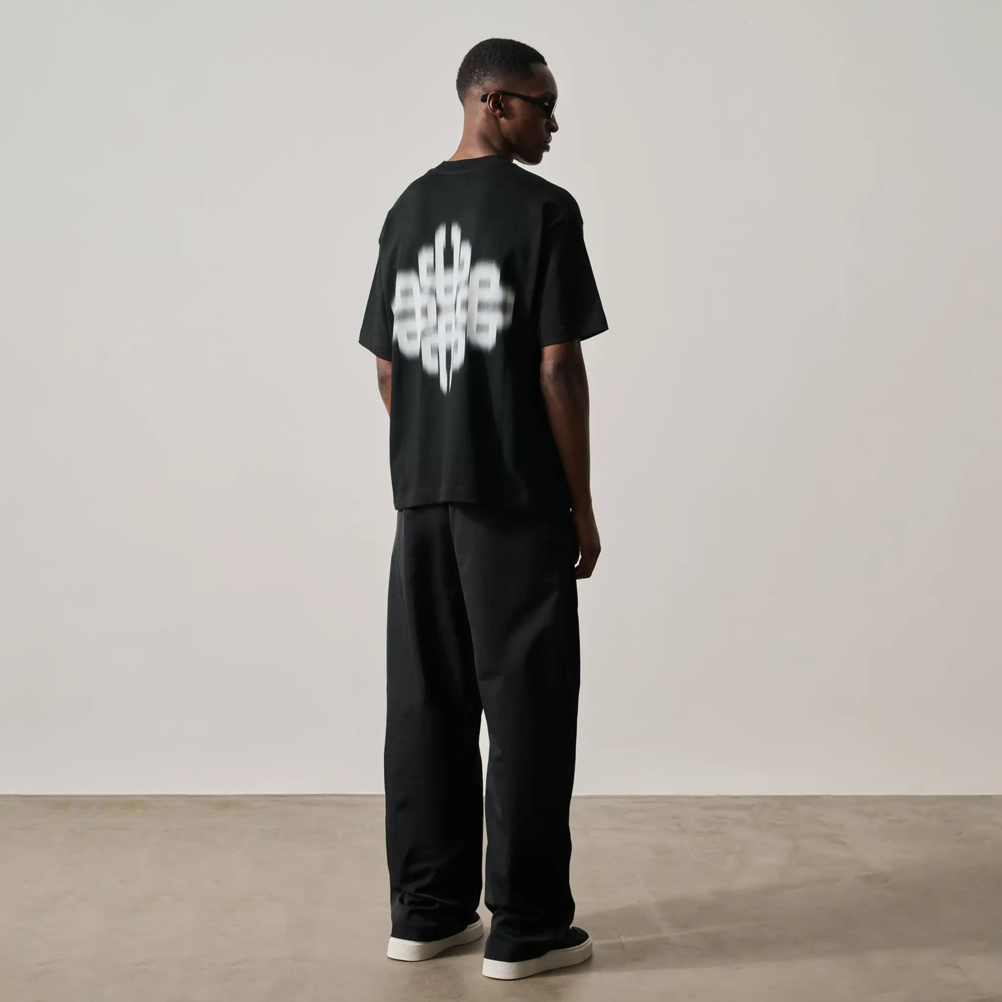 Back View of The Couture Club Motion Blurred Emblem Black T-Shirt