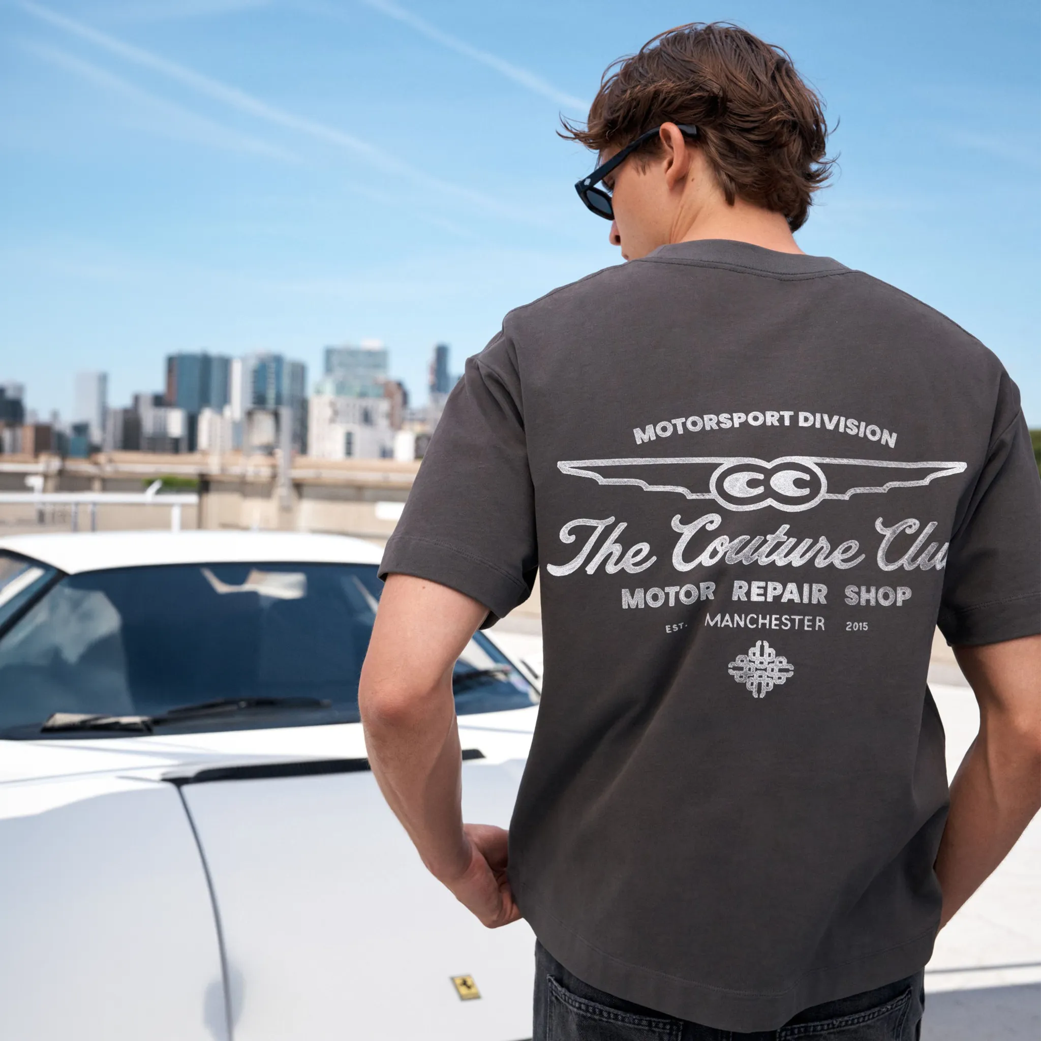Back View of The Couture Club Motor Repair Shop Graphic Charcoal White T-Shirt