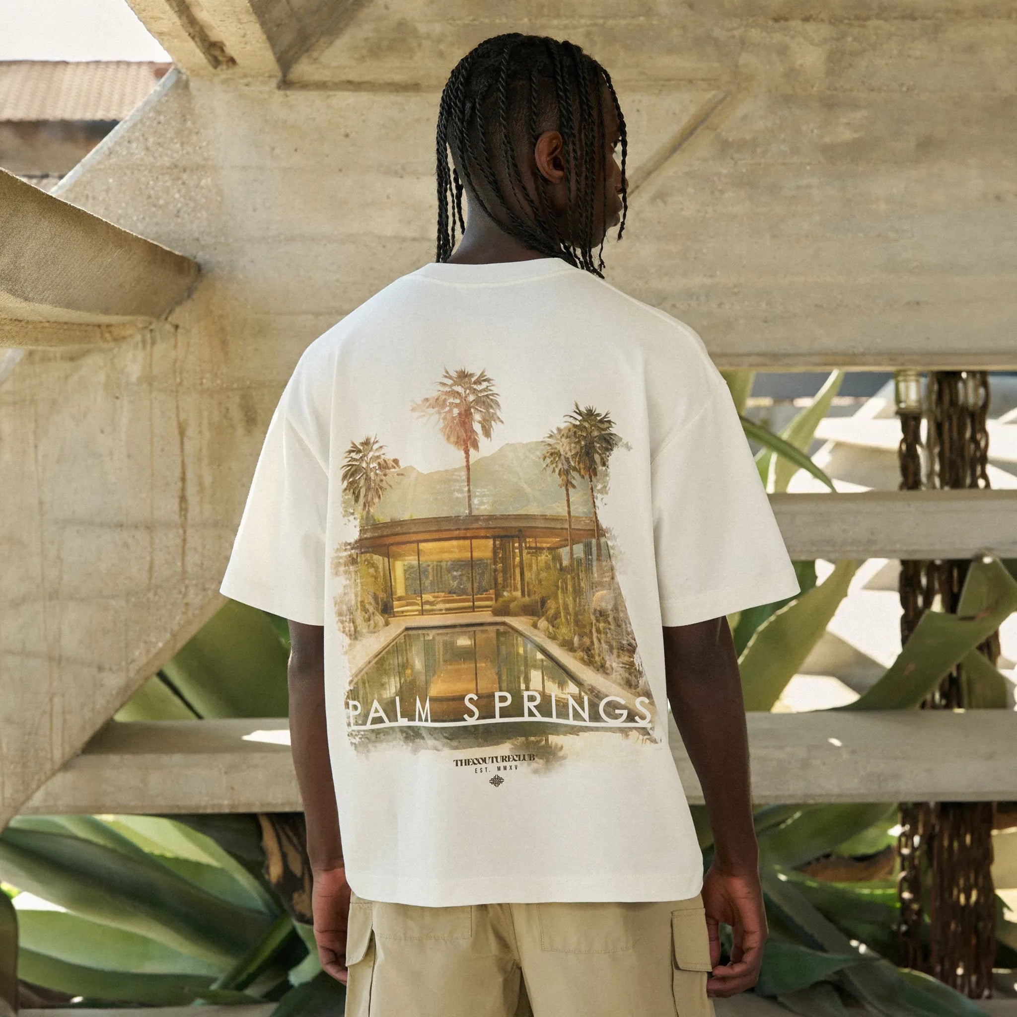 Model Back View of The Couture Club Palm Springs Graphic Off White T-Shirt