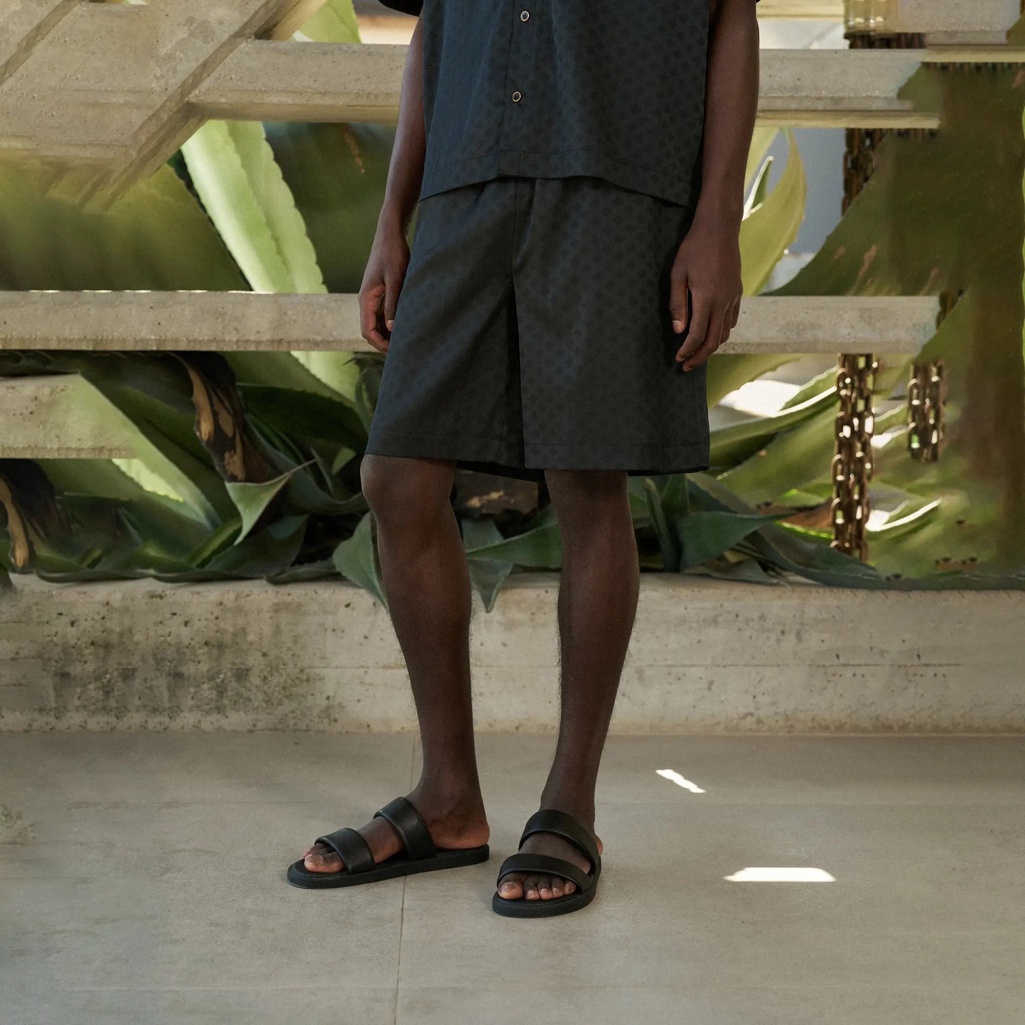 Front Side View of The Couture Club Satin Jacquard Black Shorts